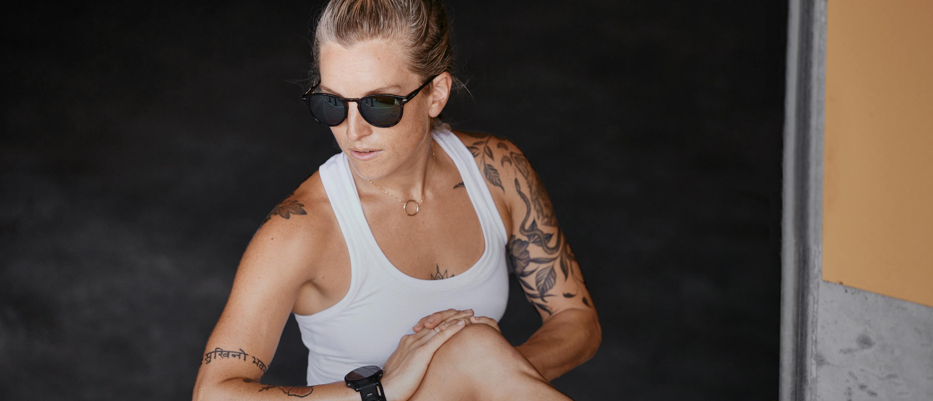 Woman stretching wearing Oslo sunglasses