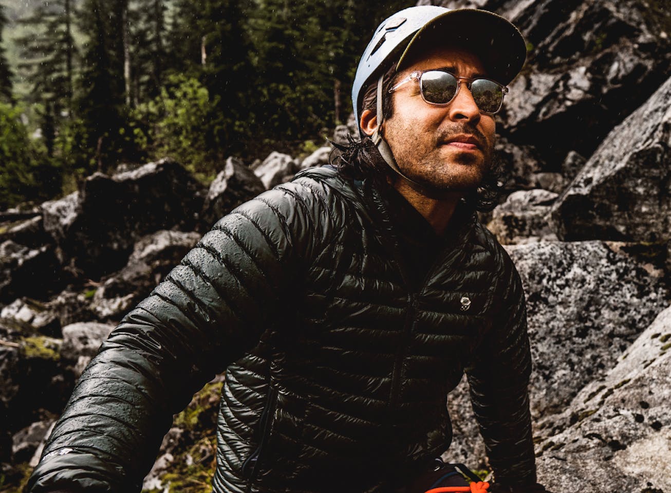 Man on bicycle in the wood and a woman doing yoga wearing Hunter sunglasses