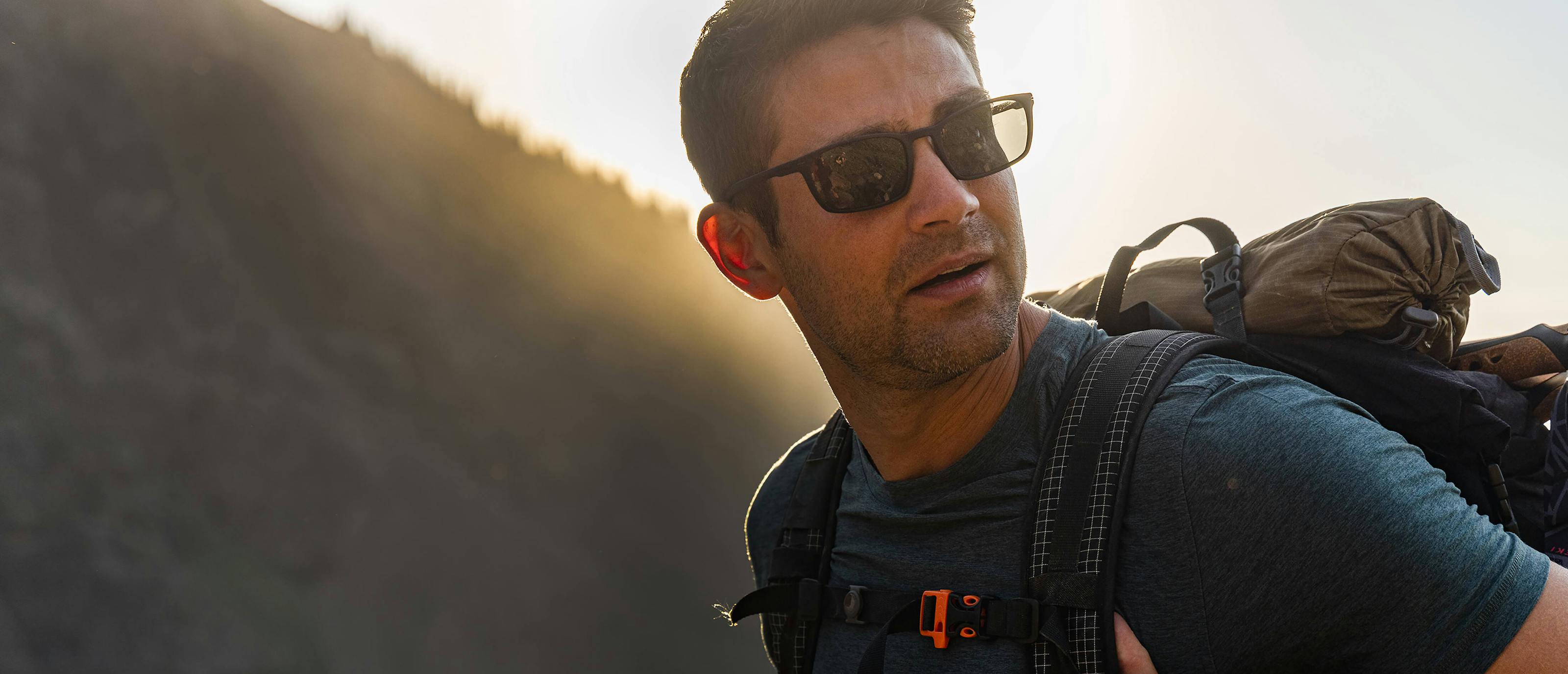 Man hiking wearing Palmer sunglasses