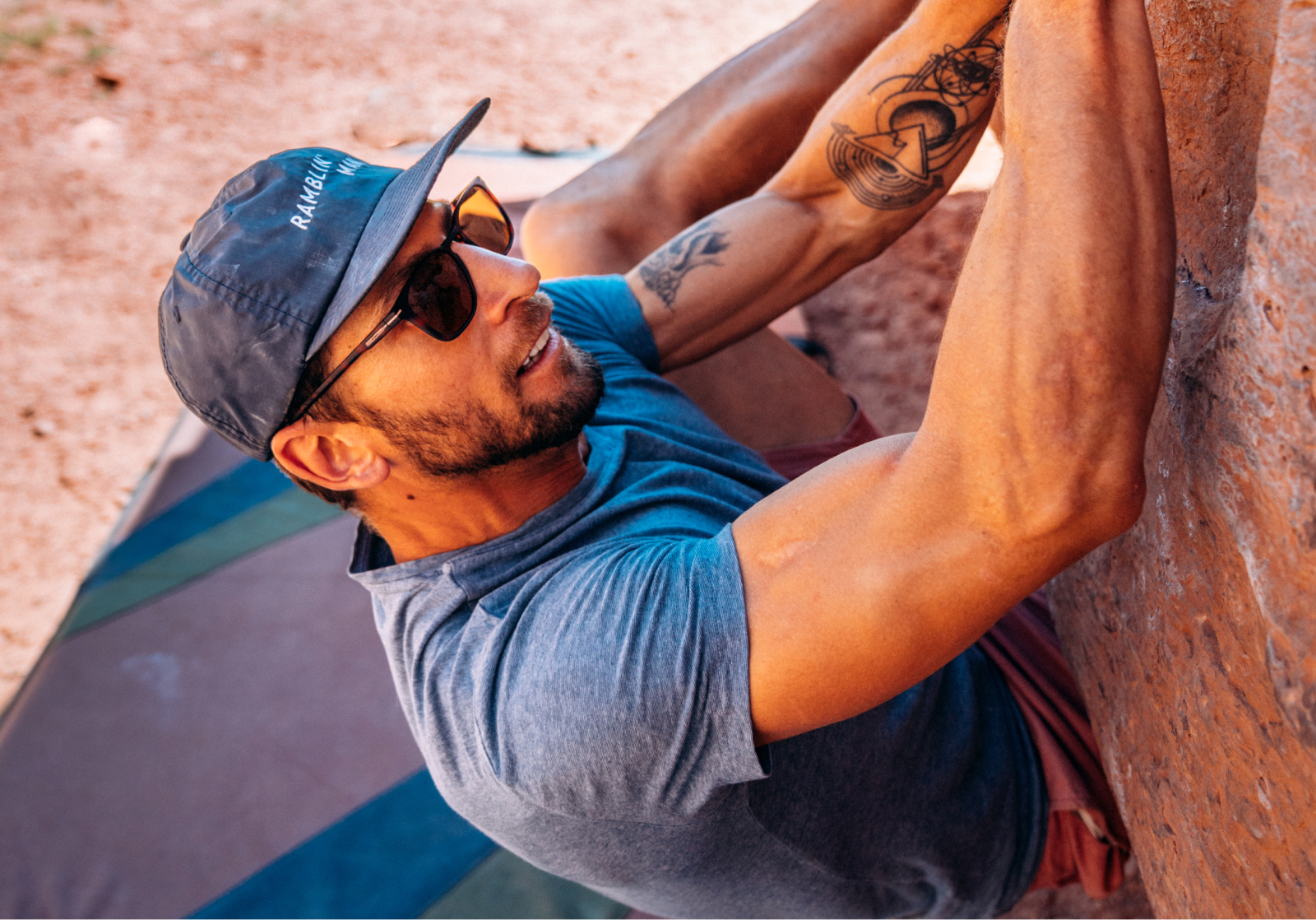 Man bouldering wearing Rory sunglasses