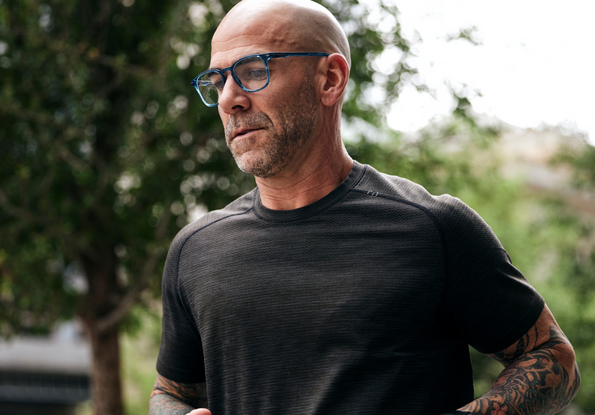 Man running wearing square, crystal slate Hunter eyeglasses