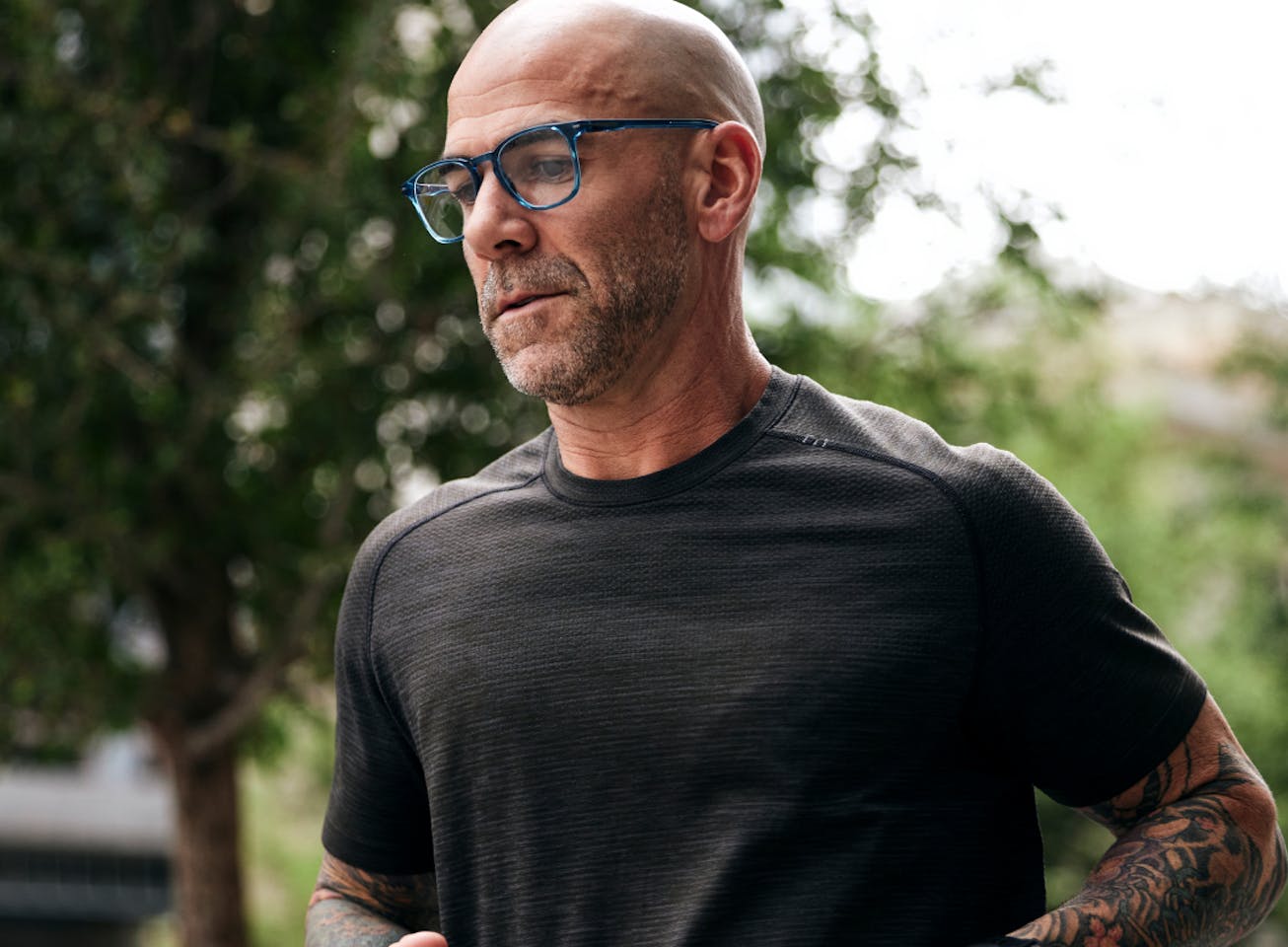Man running wearing square, crystal slate Hunter eyeglasses