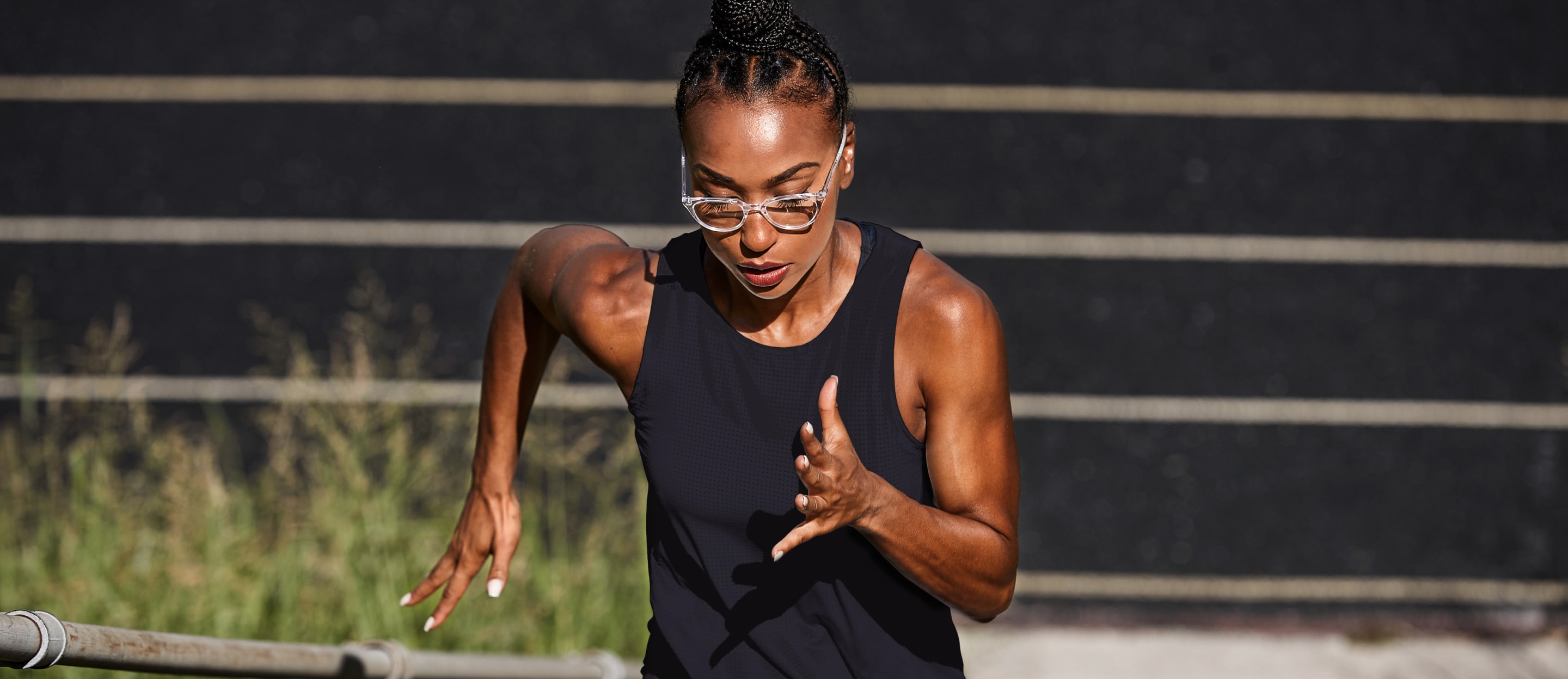 Woman running wearing cat eye shape, clear Lola eyeglasses