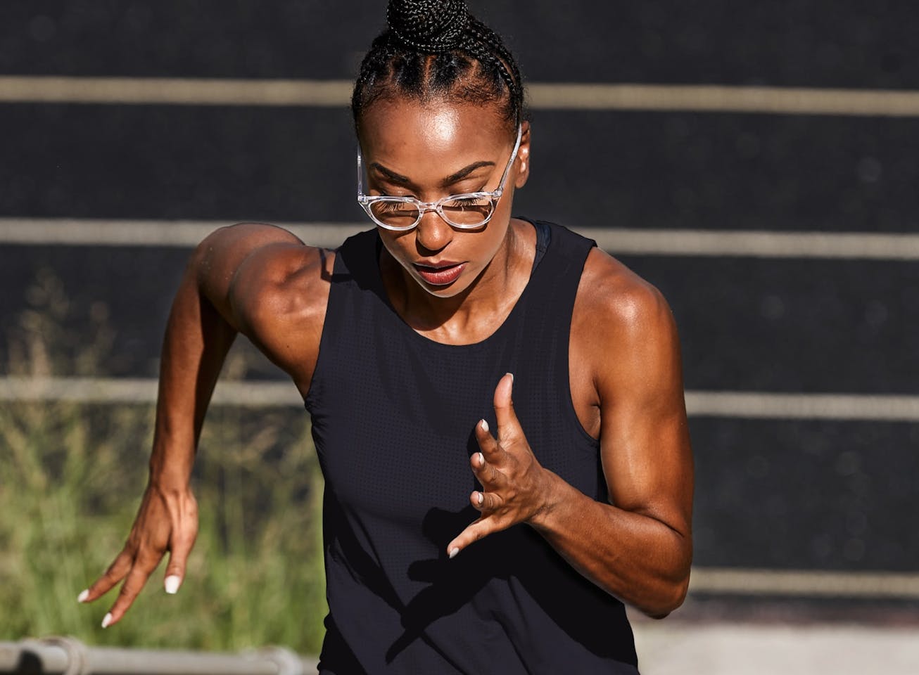 Woman running wearing cat eye shape, clear Lola eyeglasses