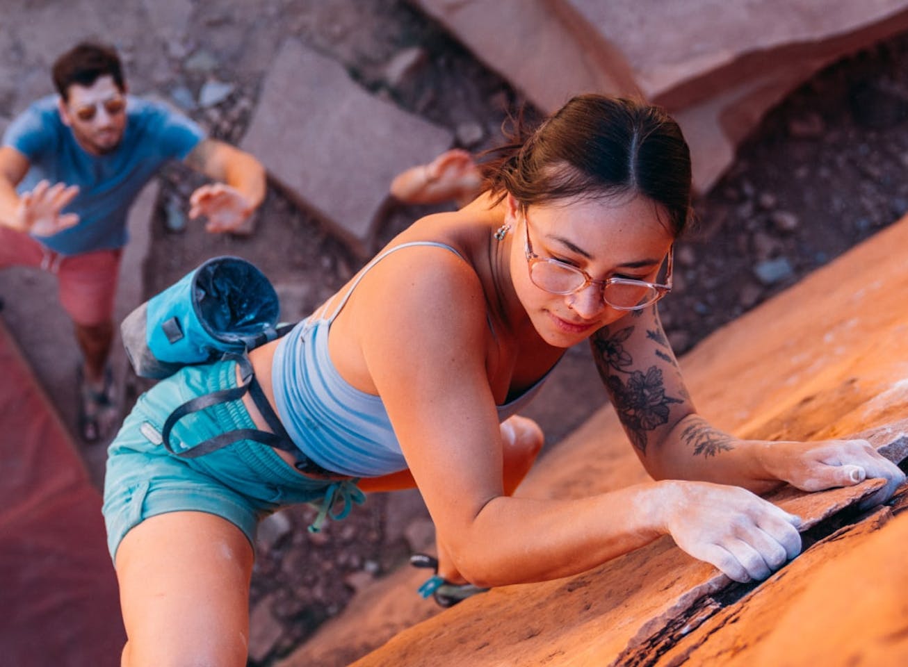 Woman climbing wearing cat eye shape, matte black Lola eyeglasses