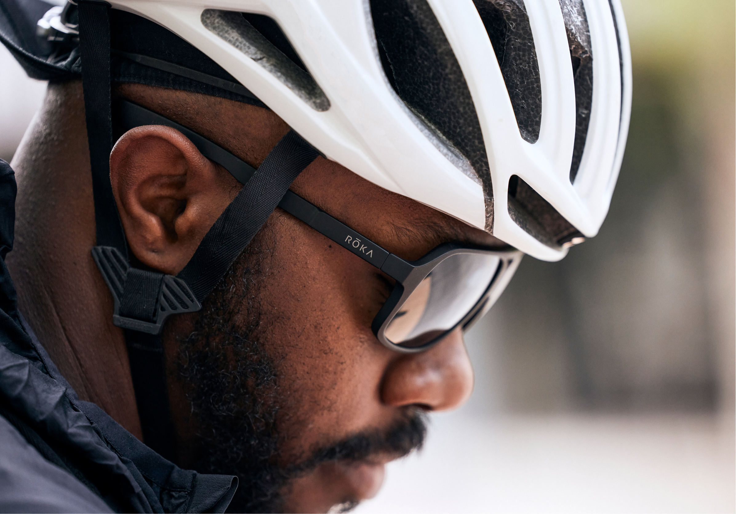 Man in white cycling helement and Torino sunglasses