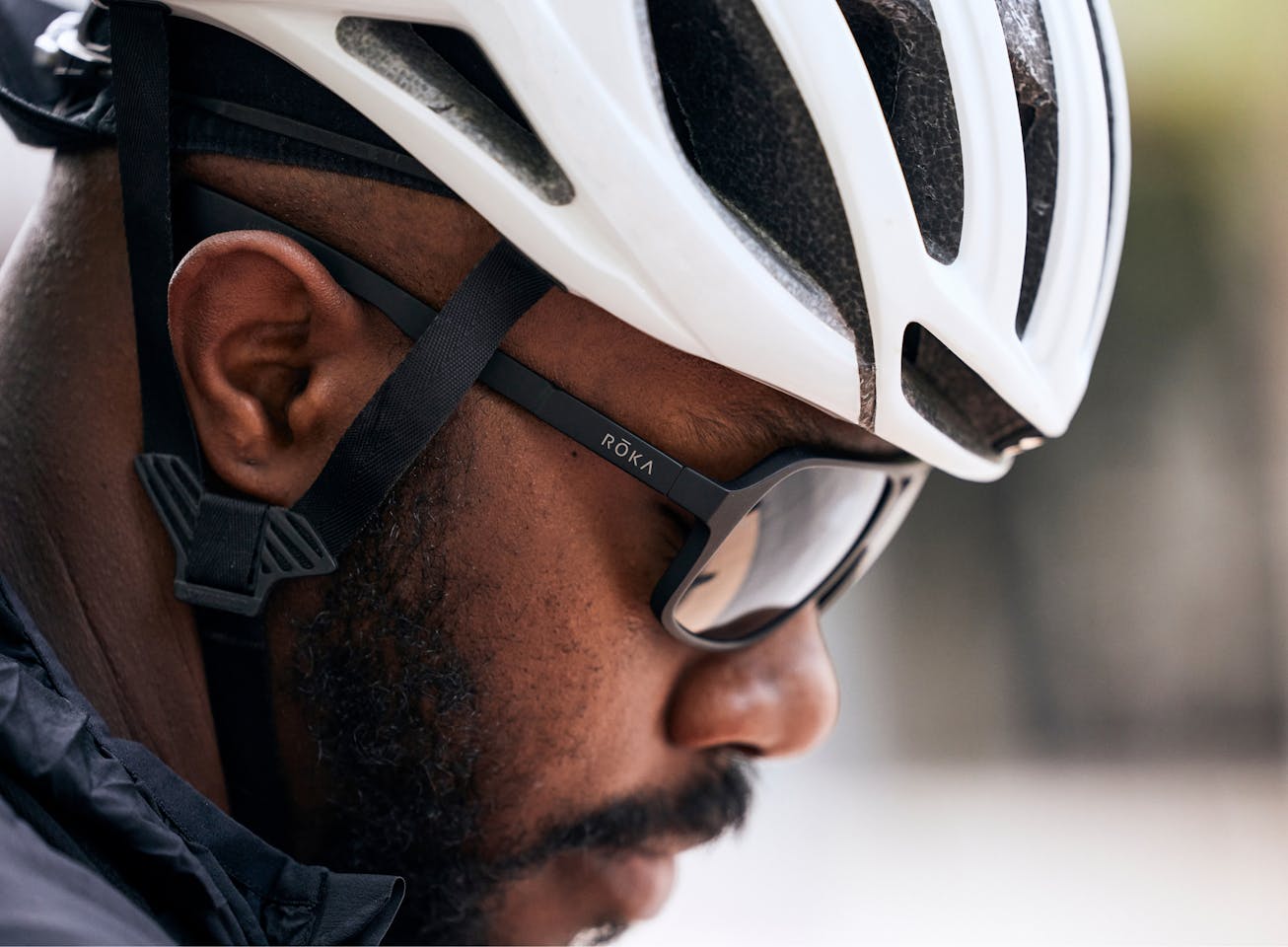 Man in white cycling helement and Torino sunglasses