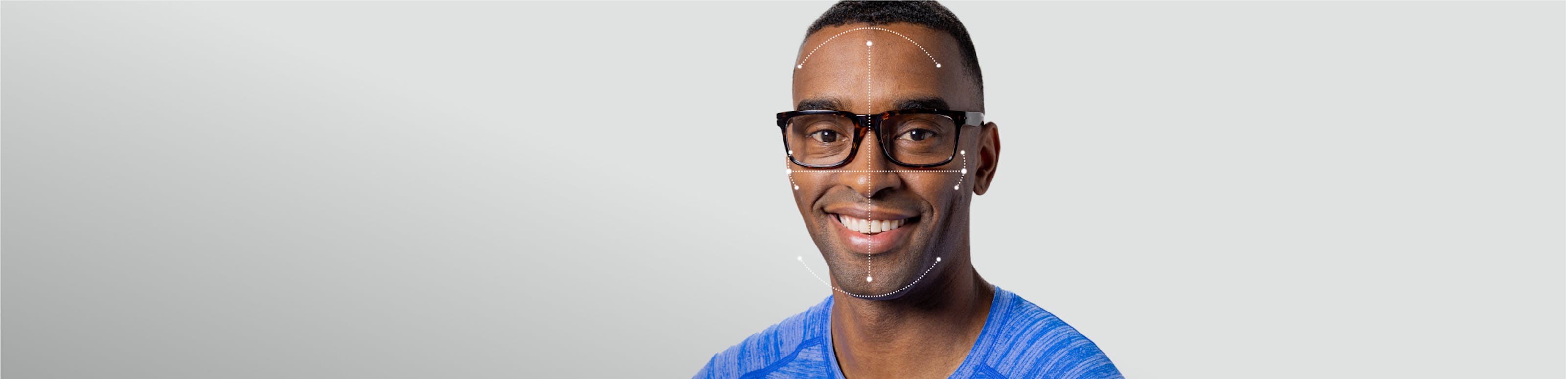 Man in blue shirt wearing Barton eyeglasses