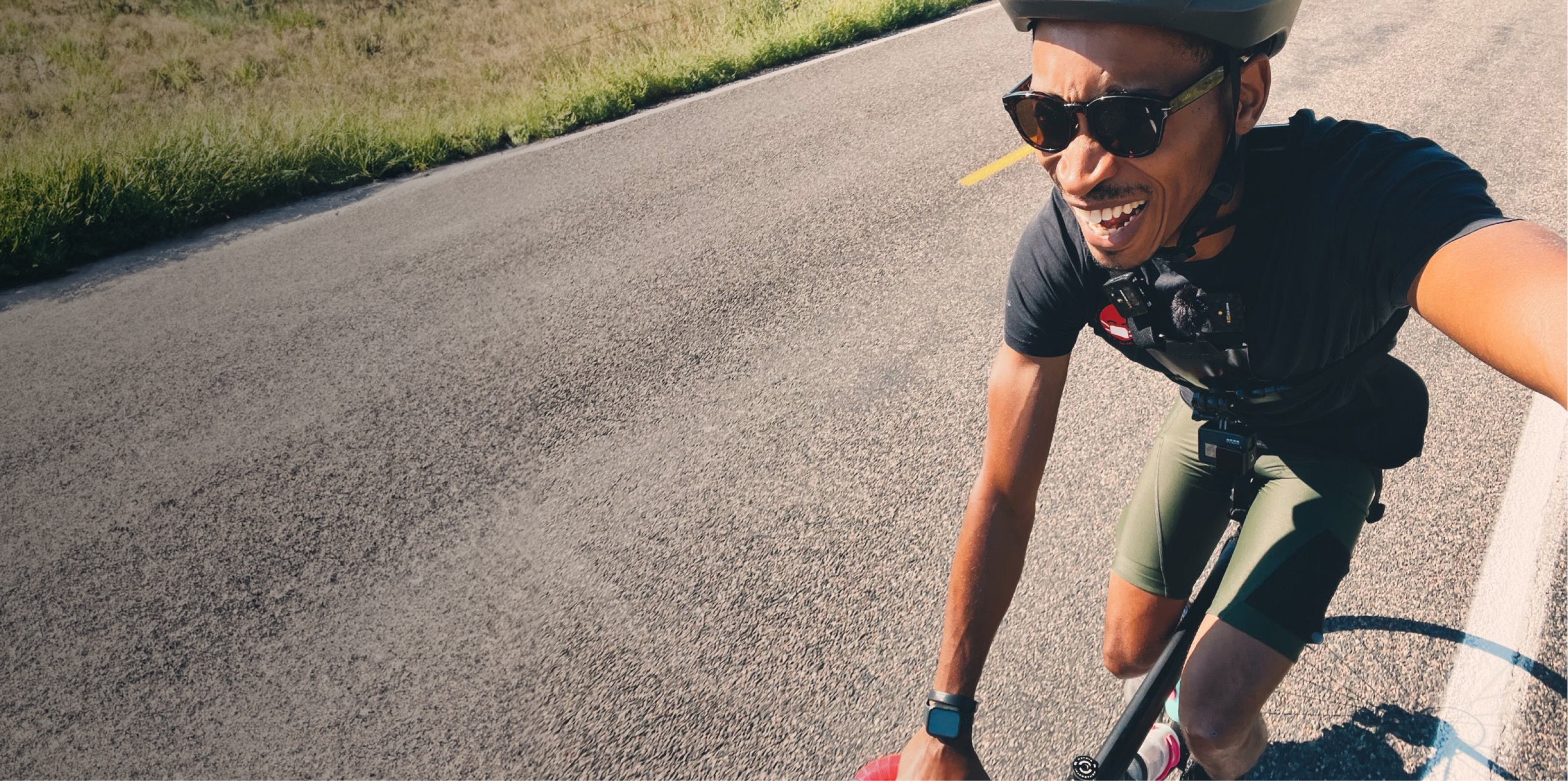Man riding bike taking a selfie in ROKA sunglasses