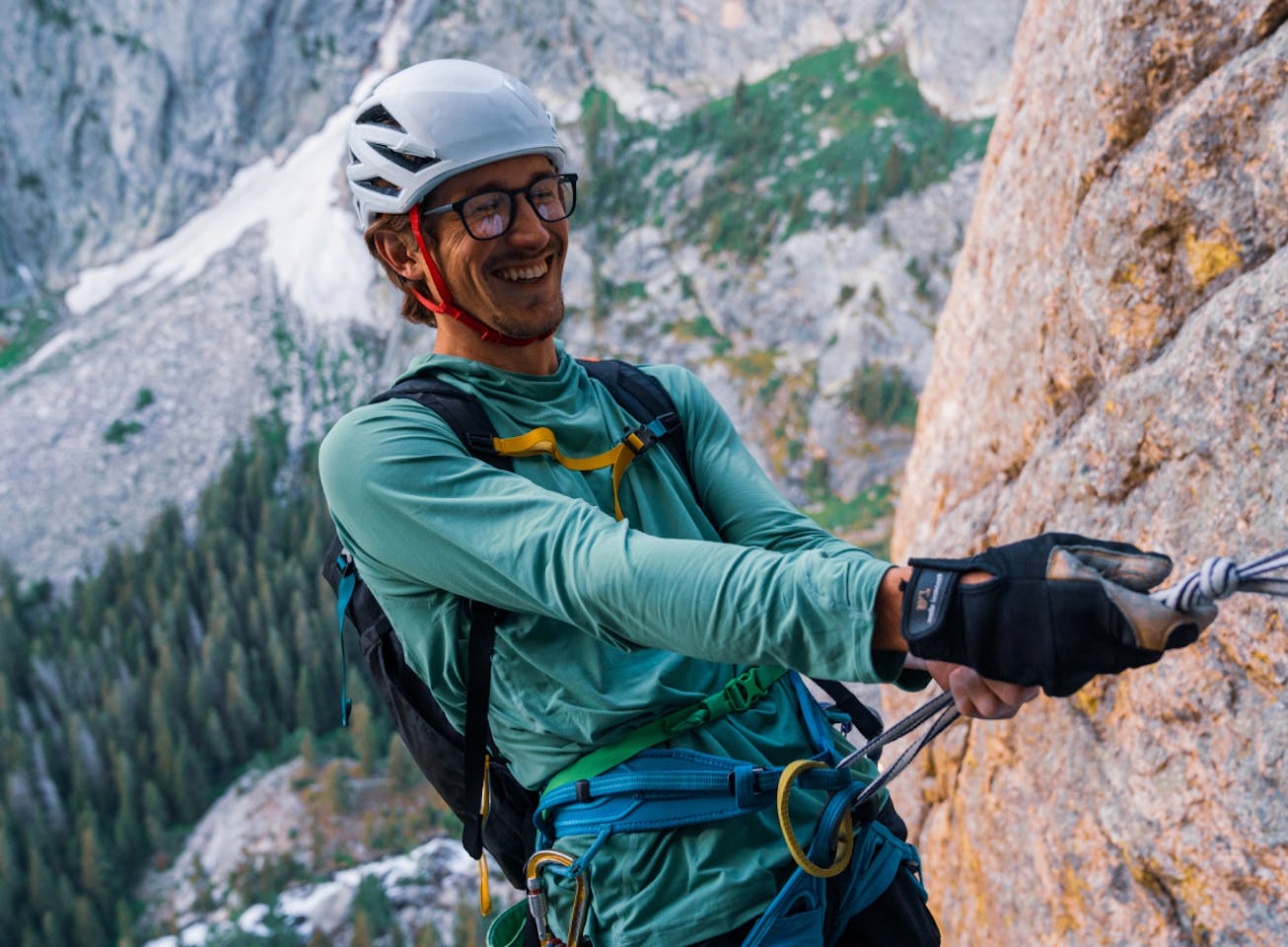 Man climbing wearing rectangular, matte black Rory eyeglasses