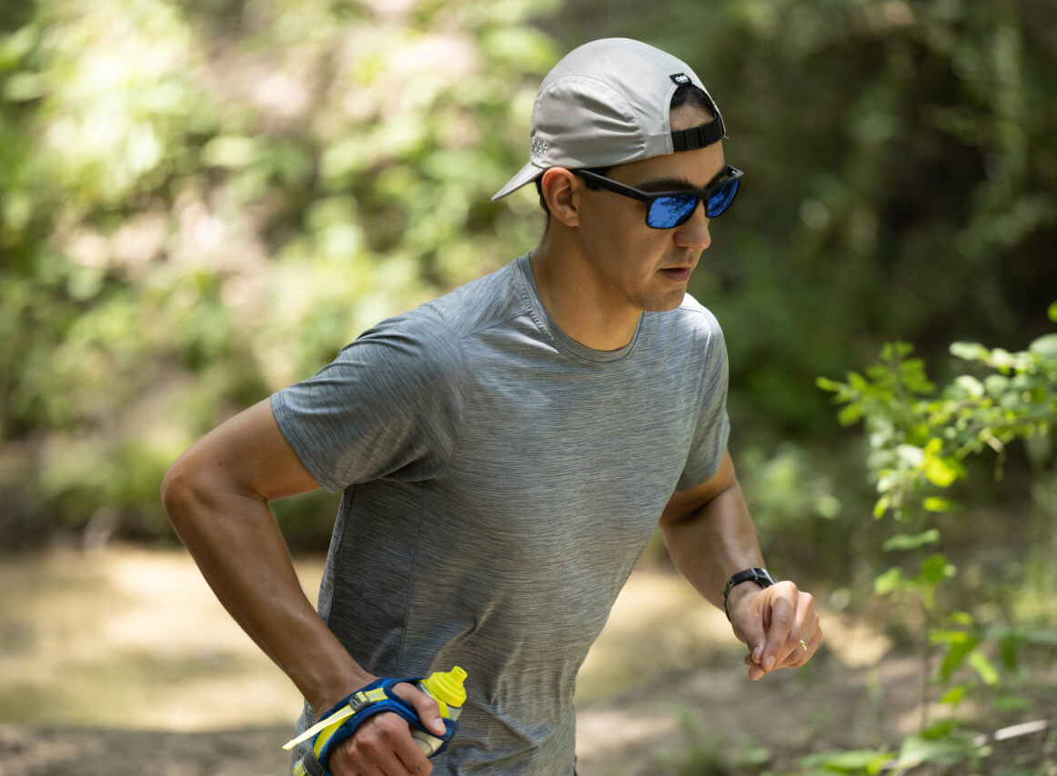 Man running outside wearing Braker sunglasses