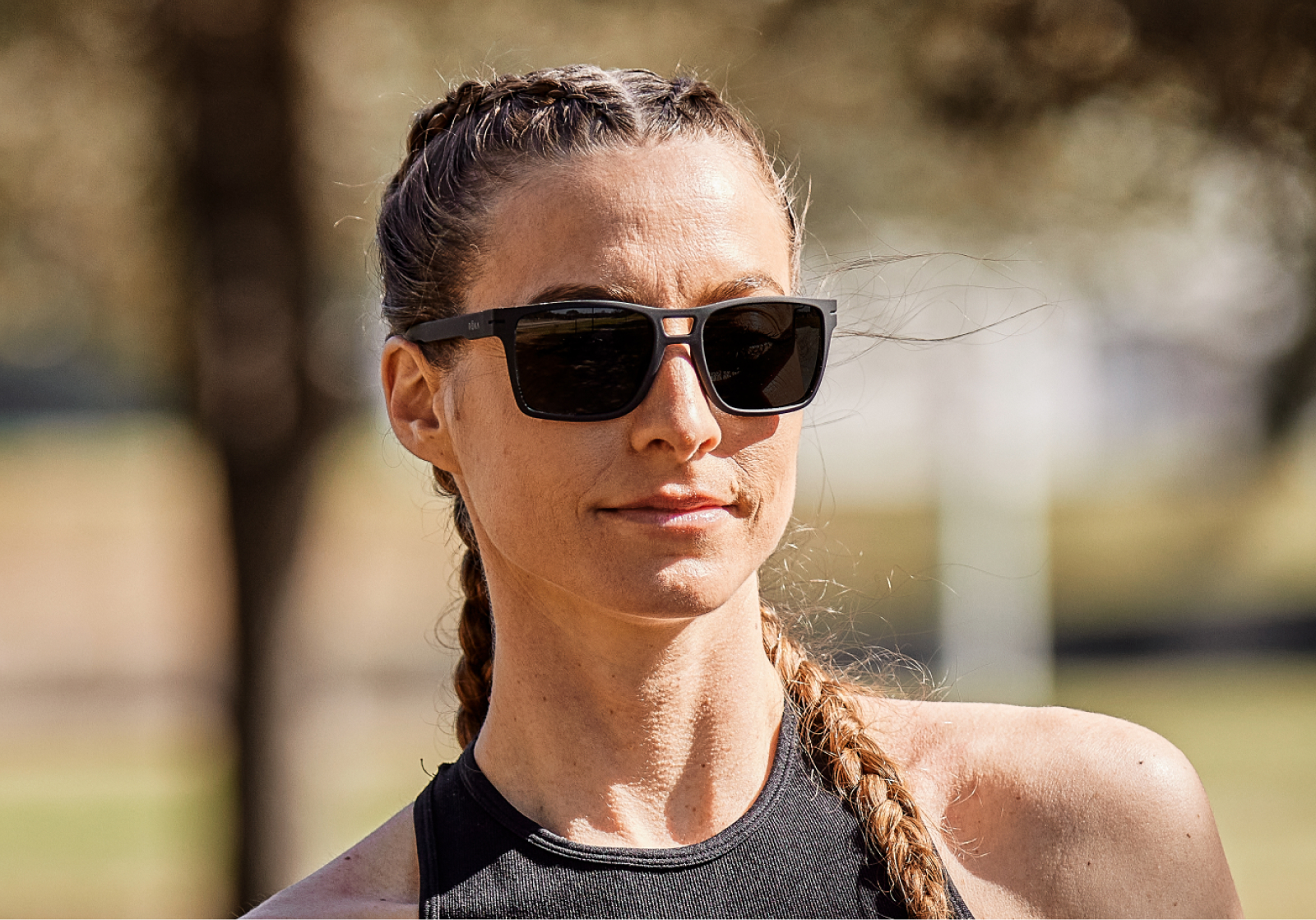 Woman outside wearing Kona sunglasses