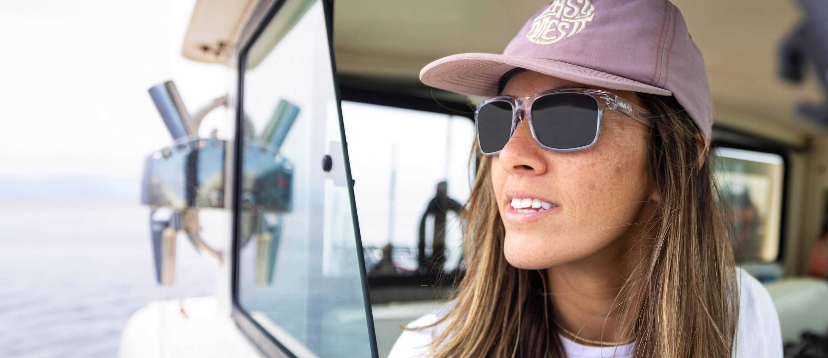 Woman on boat wearing Barton sunglasses
