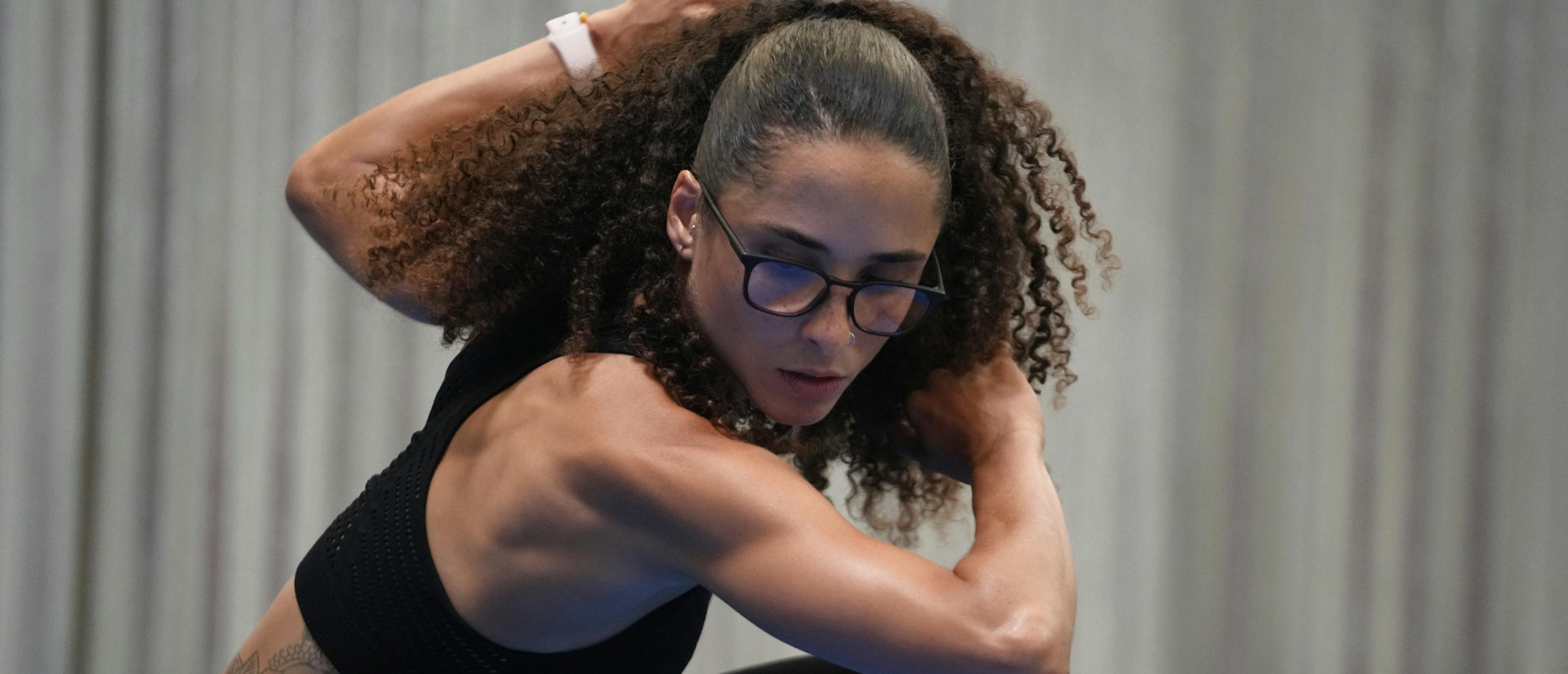 Woman exercising wearing Cade eyeglasses