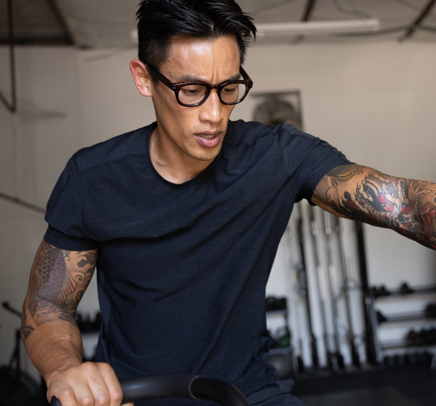 Man working out in gym wearing Hamilton eyeglasses