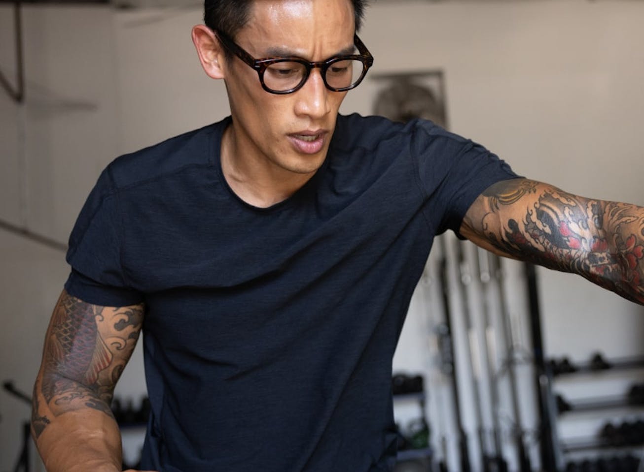 Man working out in gym wearing Hamilton eyeglasses