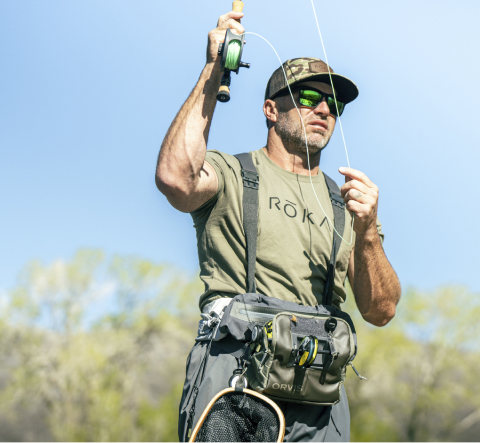 Man reeling in fishing line