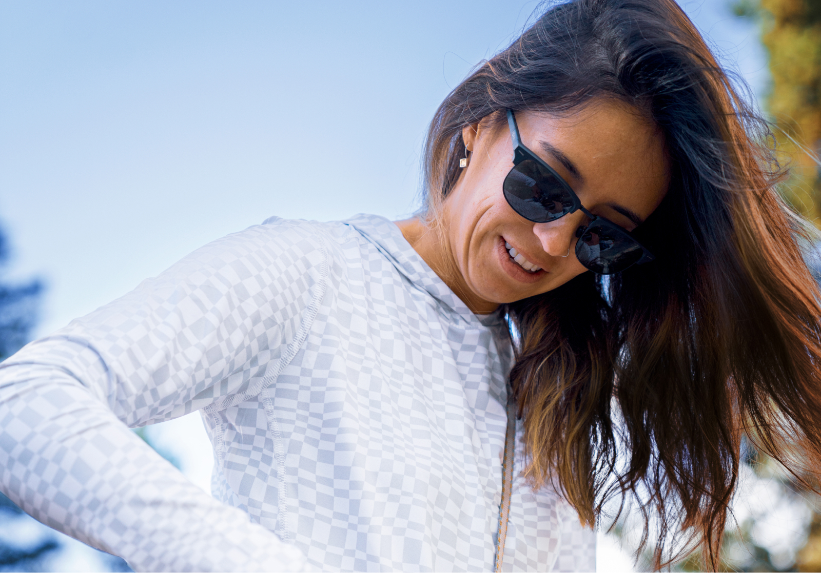 Woman looking down wearing Cambridge sunglasses