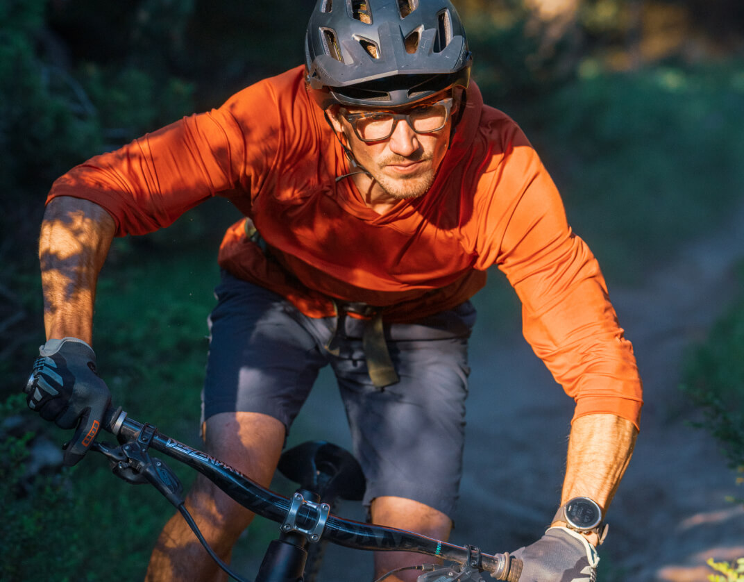 Man mountain biking in Lockhart eyeglasses