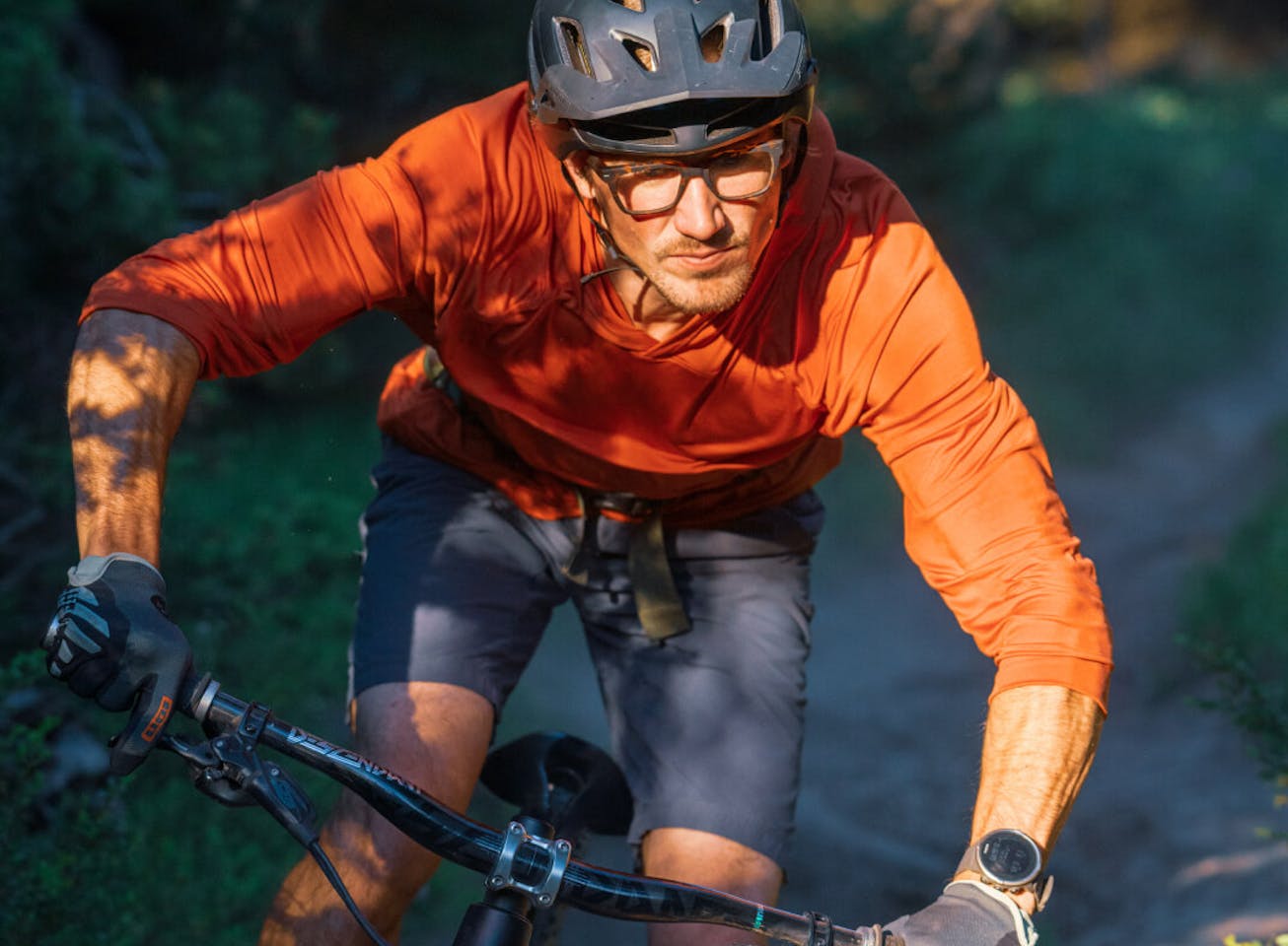 Man mountain biking in Lockhart eyeglasses