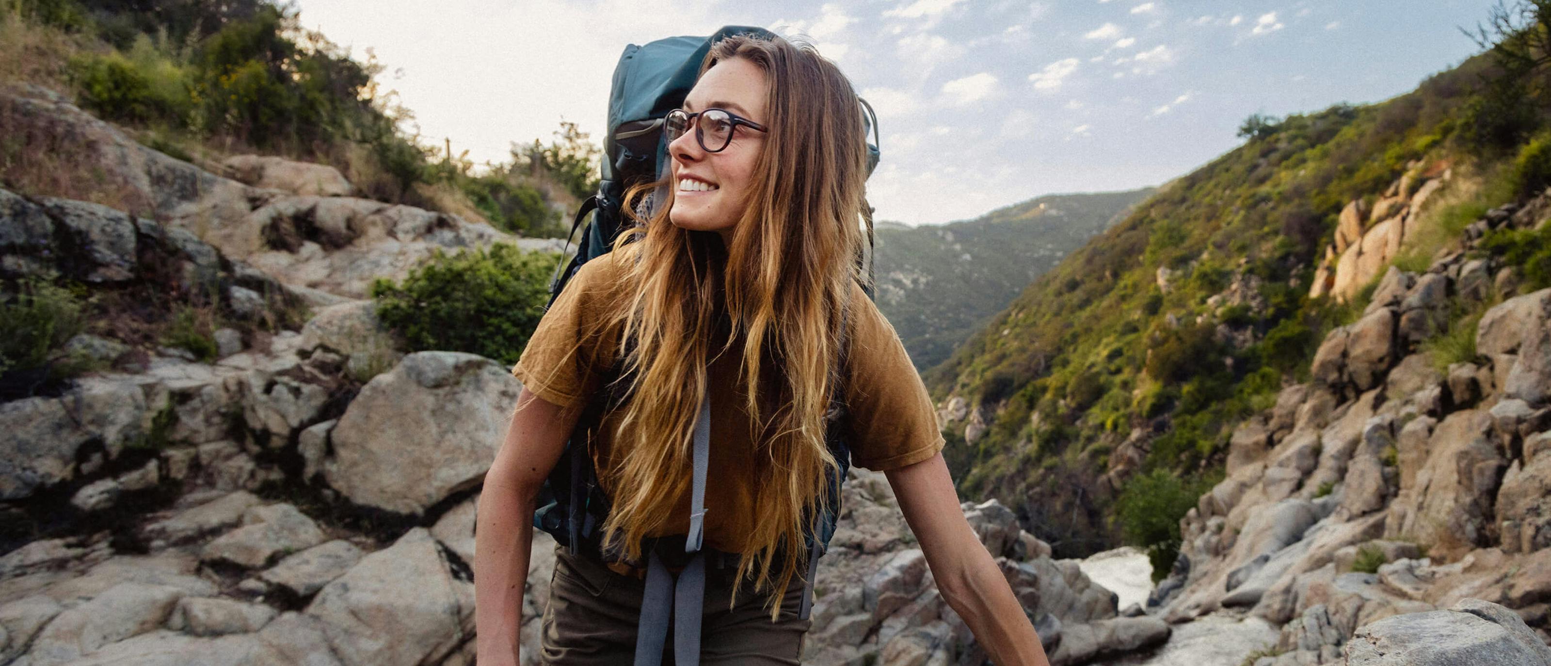 Woman hiking with ROKA eyeglasses