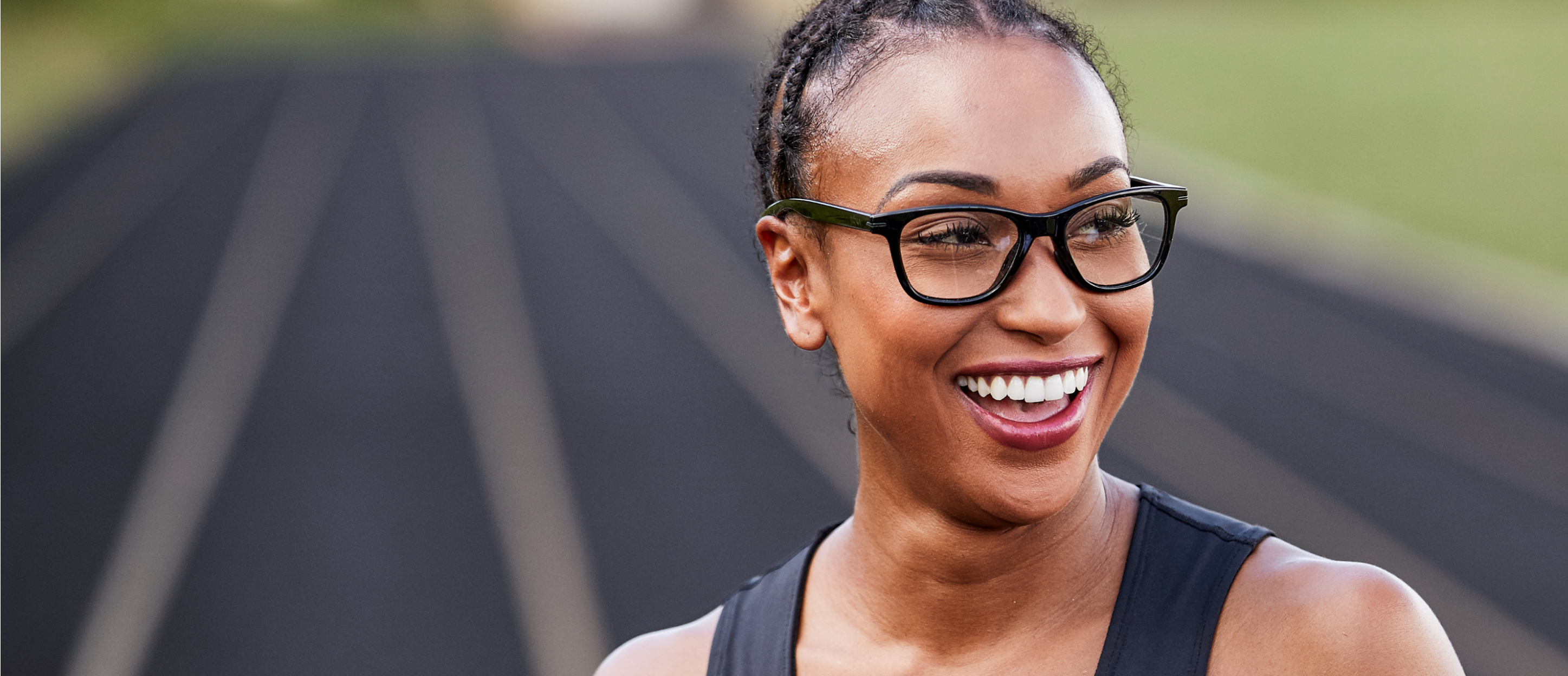 Woman smiling wearing Zilker eyeglasses