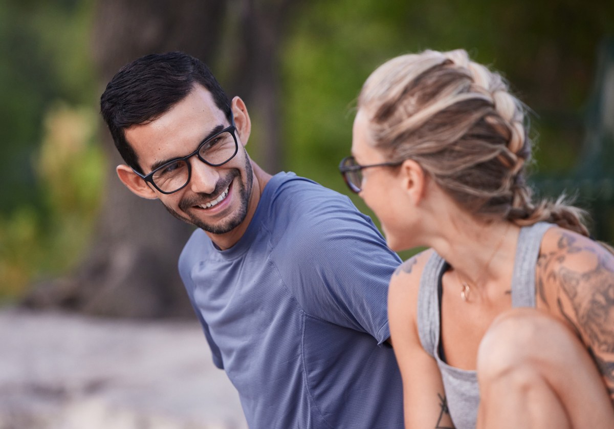 Man and woman smiling outsite