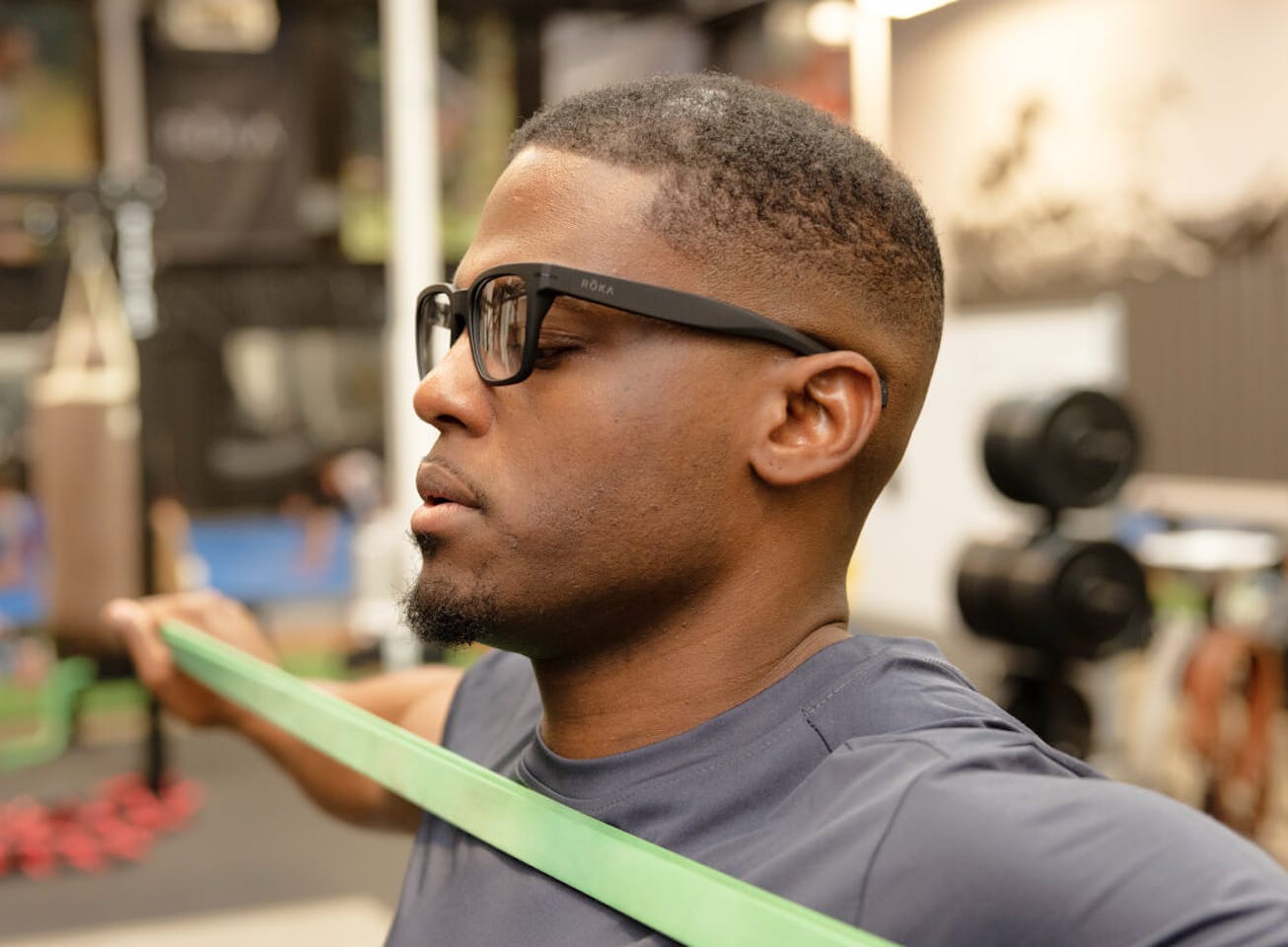 Man doing a band workout in Lockhart eyeglasses