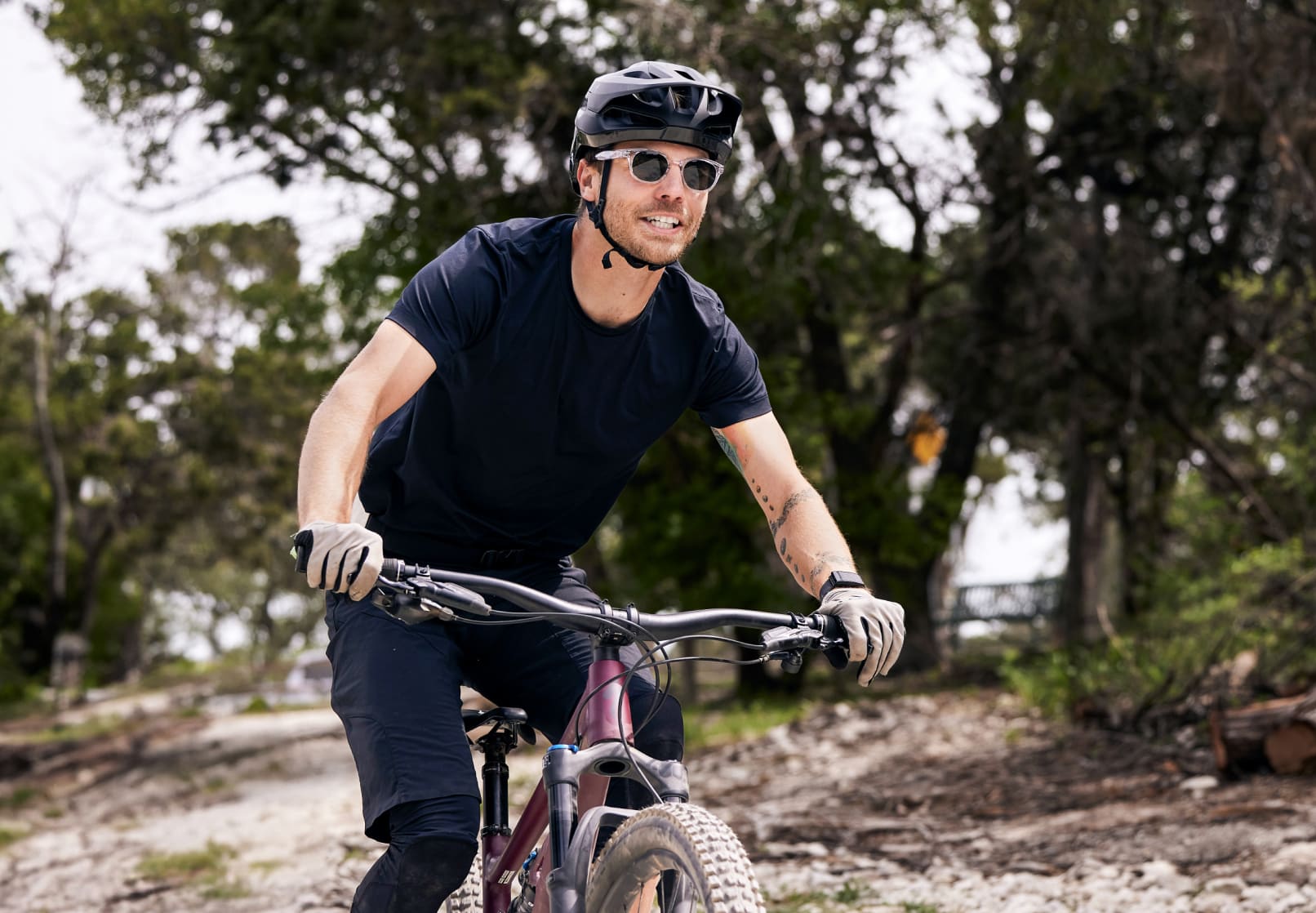 Man cycling wearing Hamilton sunglasses