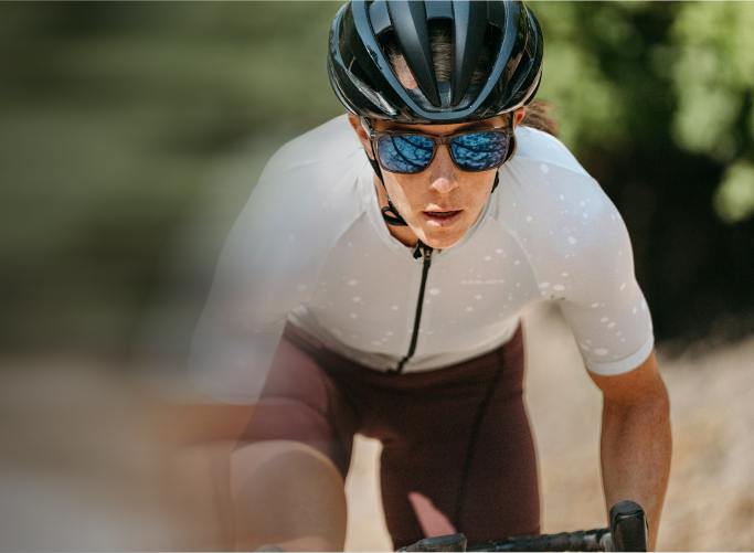 Woman cycling in ROKA sunglasses