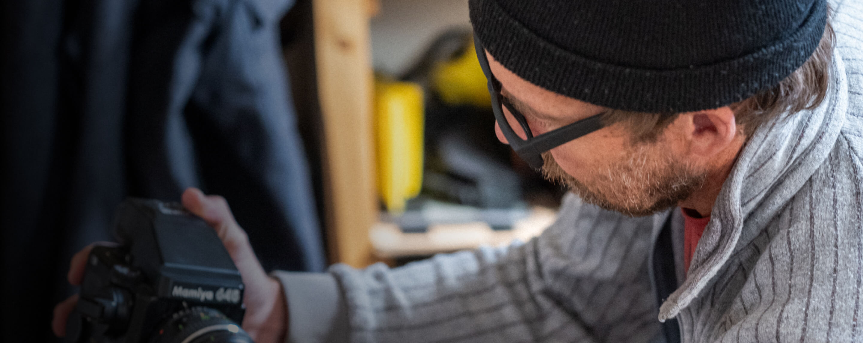 Man in black beanie looking at camera