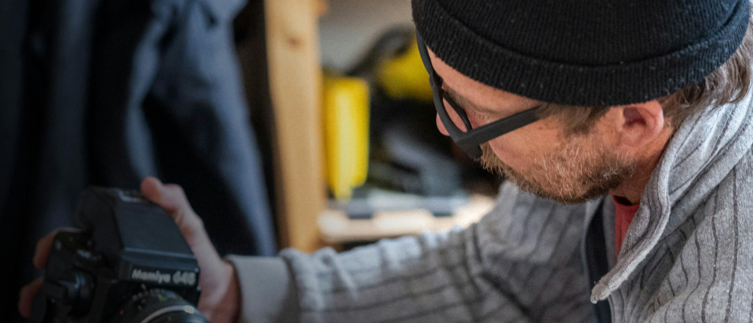 Man in black beanie looking at camera
