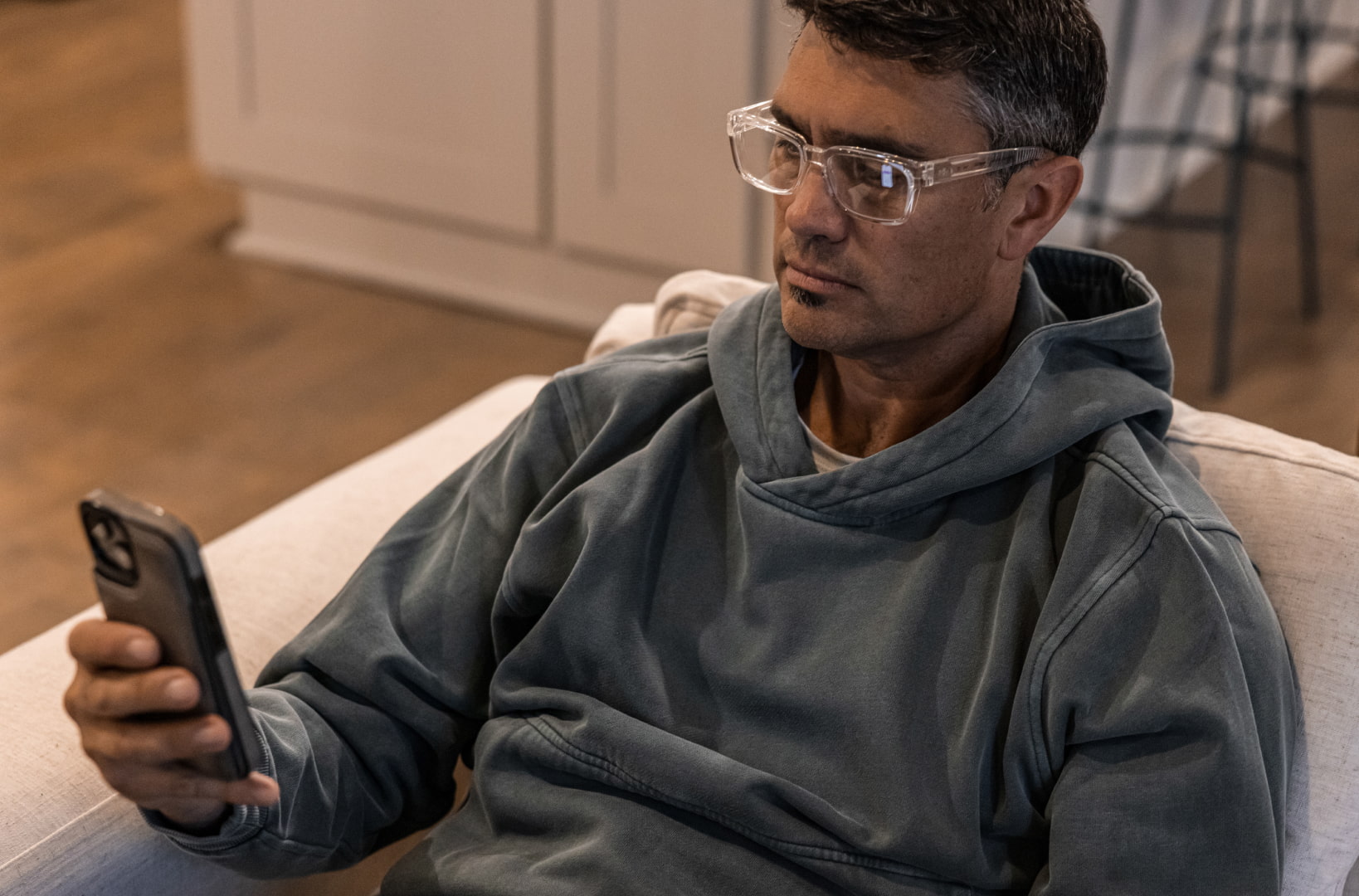 Man looking at phone in Whistler eyeglasses
