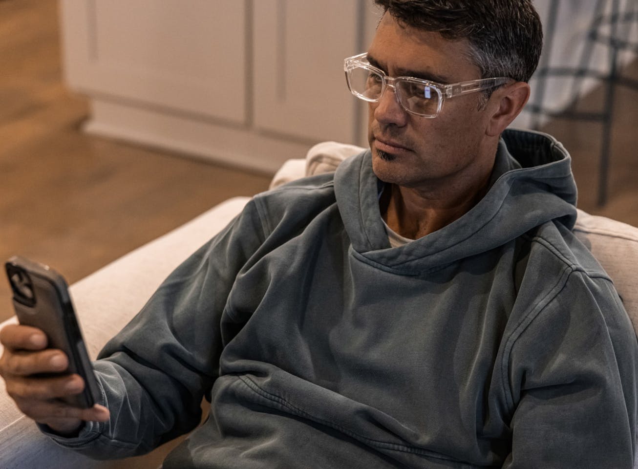 Man looking at phone in Whistler eyeglasses