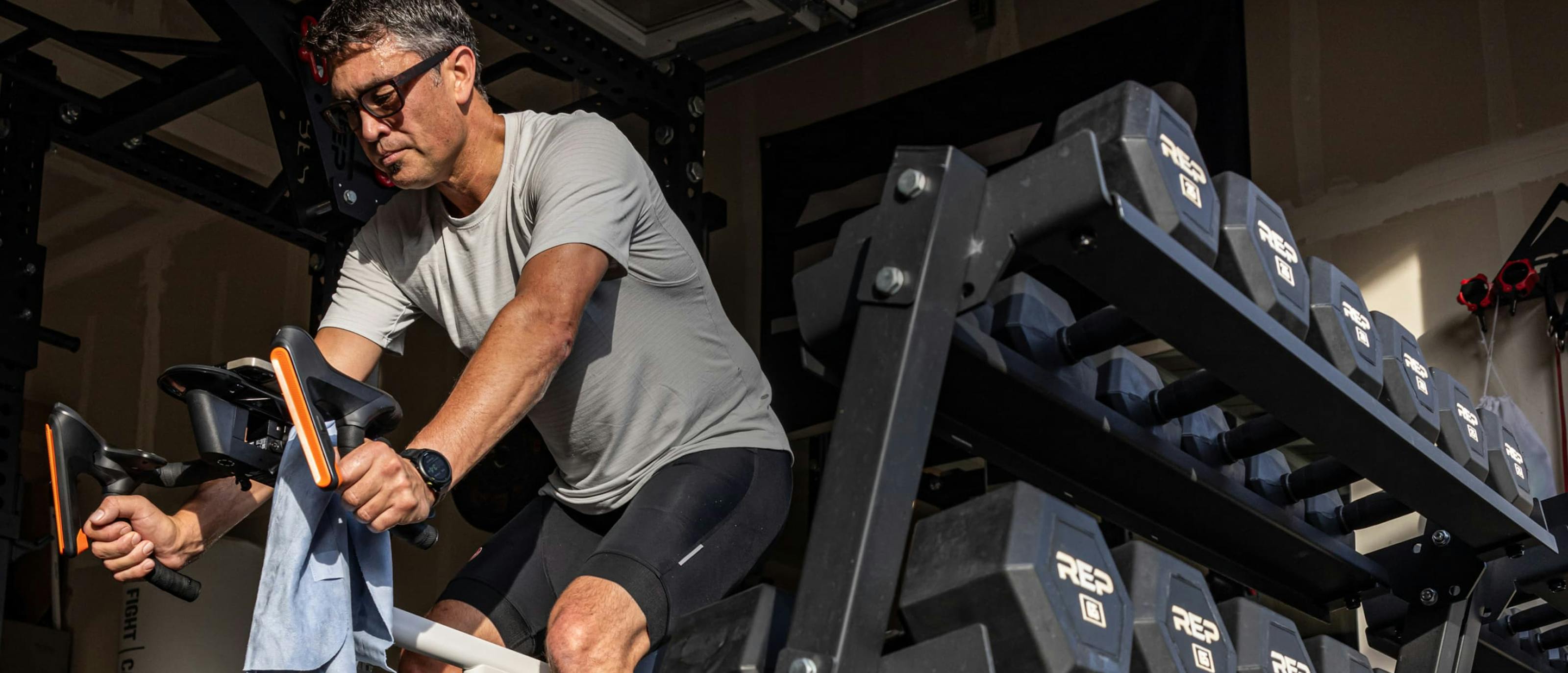 Man on stationary bike and Whistler eyeglasses