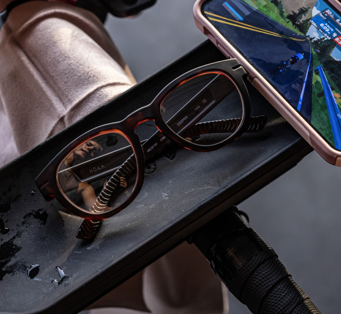 Cooper eyeglasses next to phone