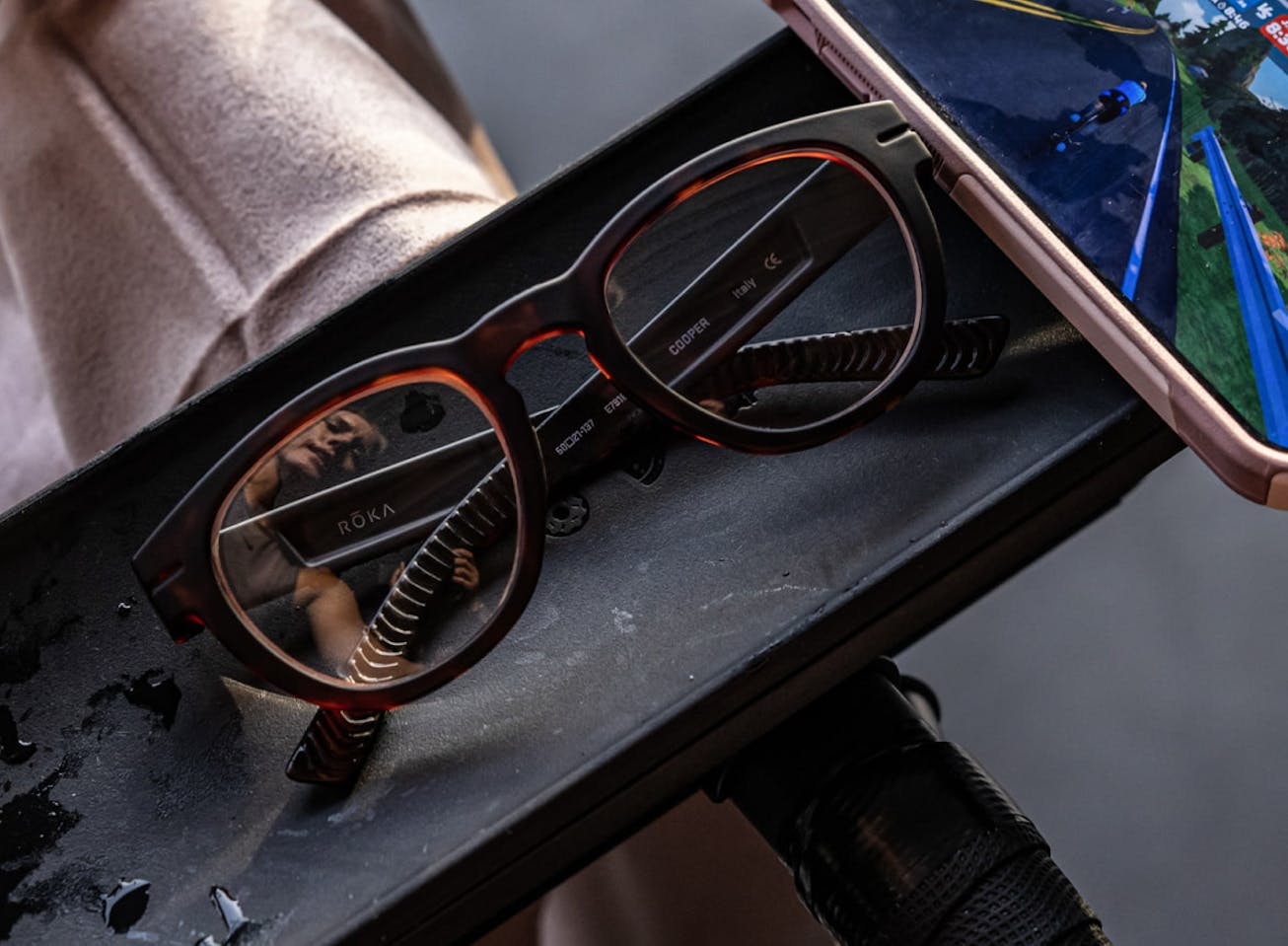 Cooper eyeglasses next to phone