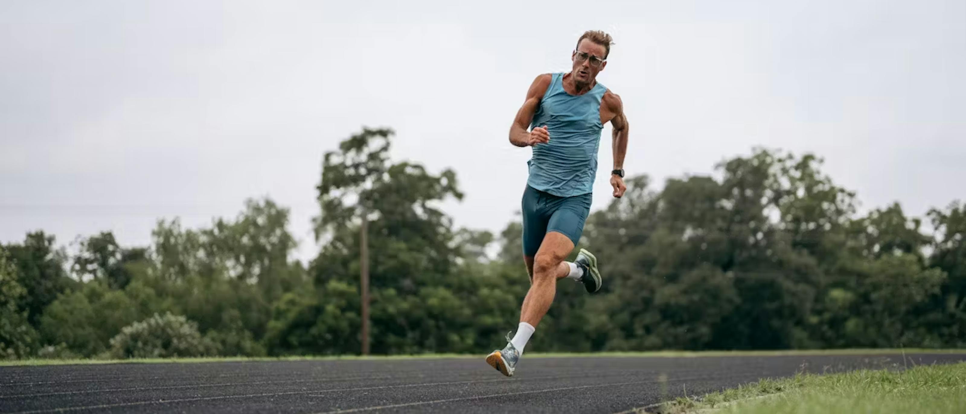 Man runing on track in Estacado eyeglasses