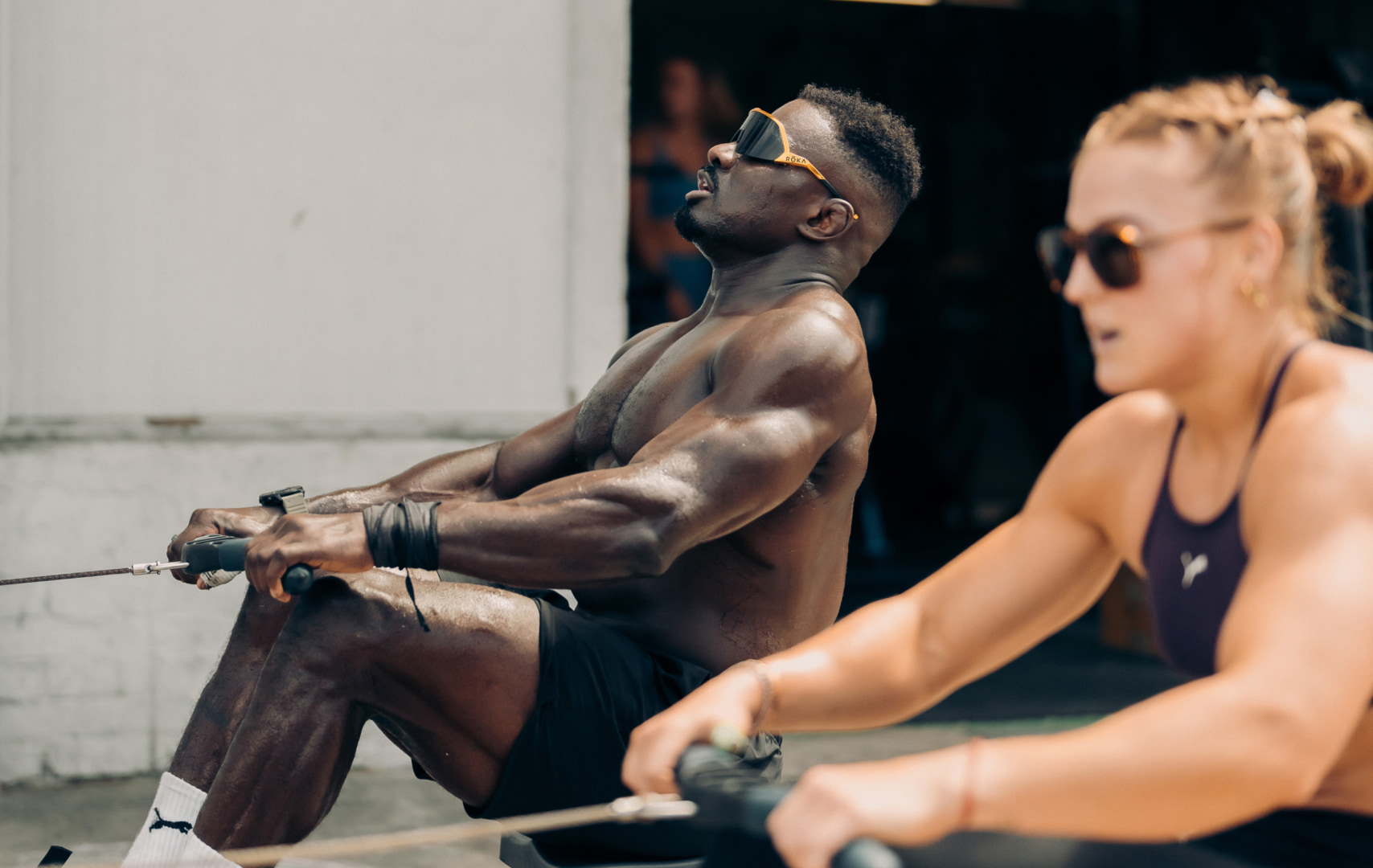 Man and woman doing rowing exercise