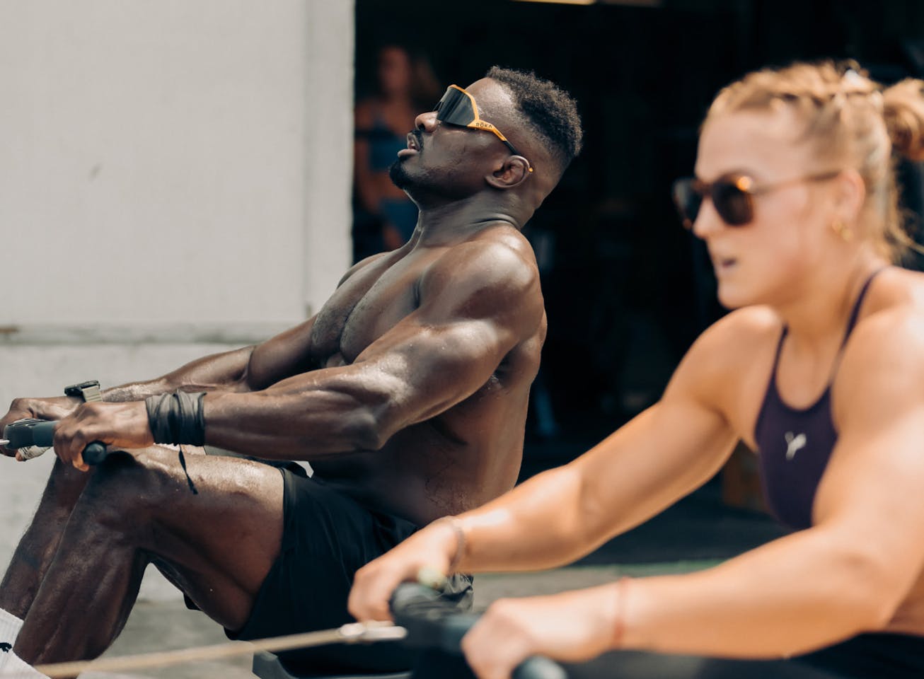 Man and woman doing rowing exercise