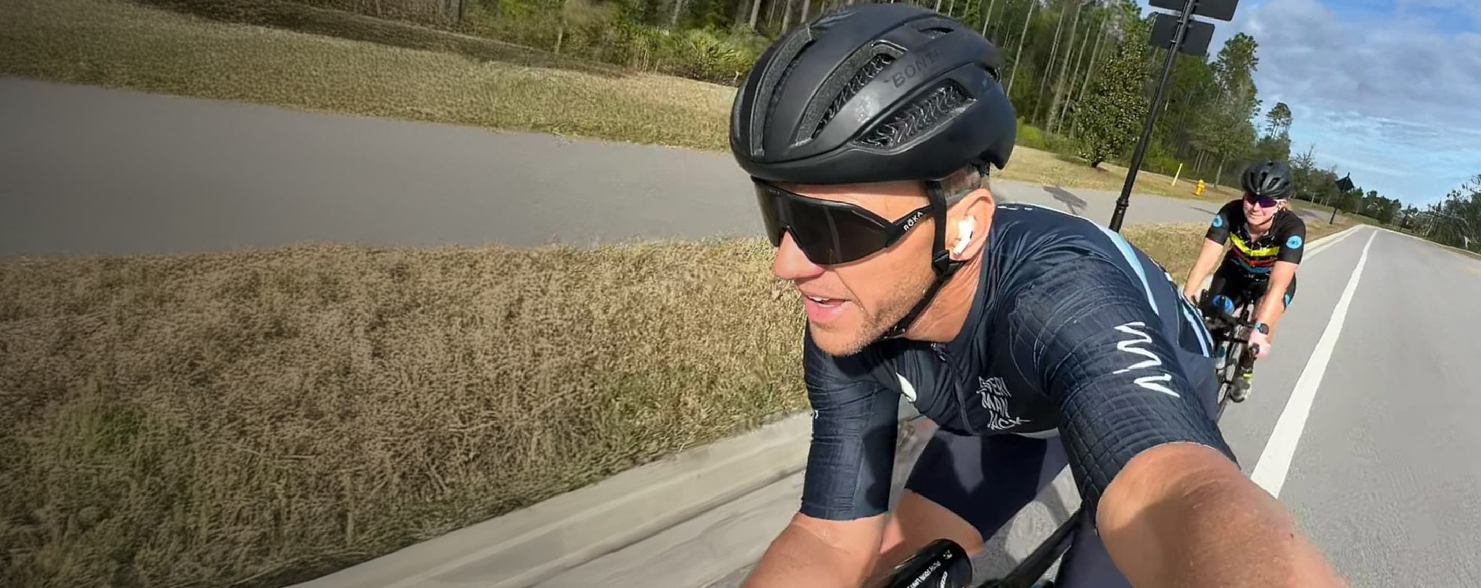 Man on bike in black helment and Matador AIR sunglasses