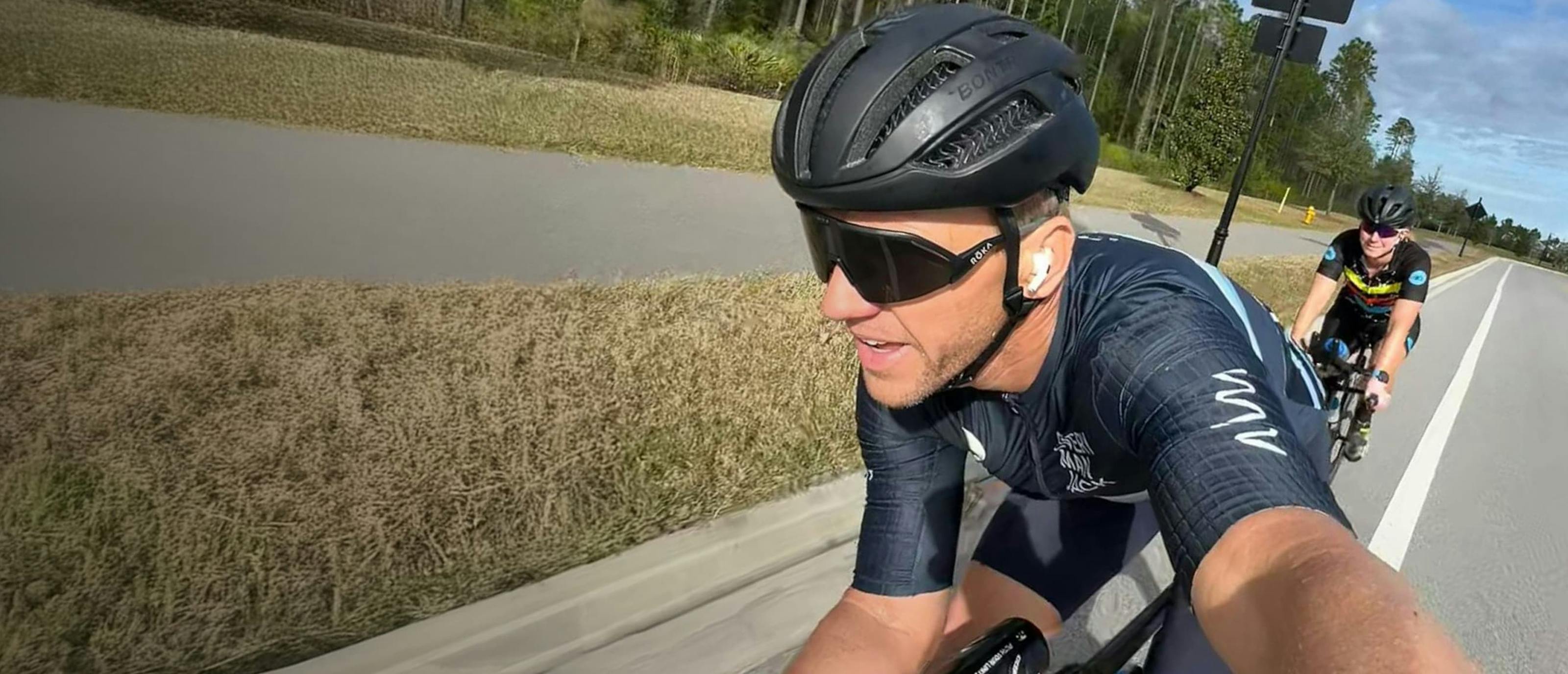 Man on bike in black helment and Matador AIR sunglasses