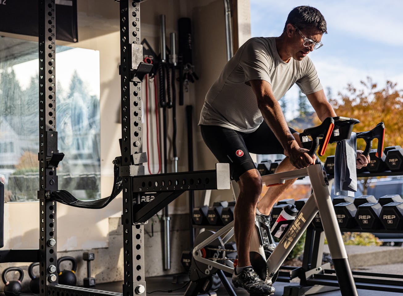Man on stationary bike in garage gym