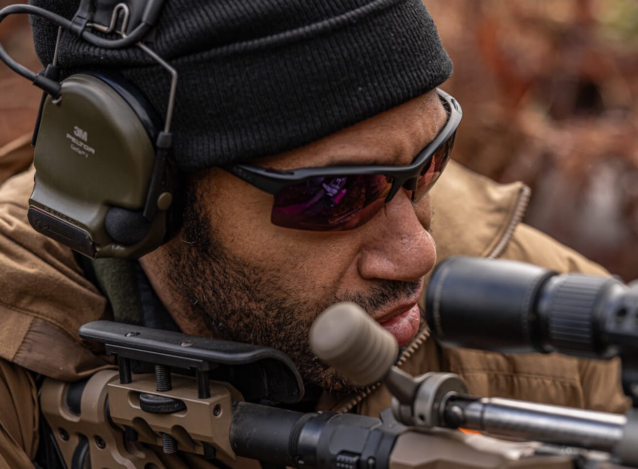 Man Looking through scope in tl-1 sunglasses
