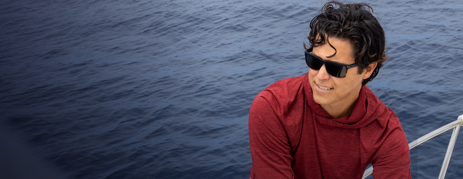 Man near ocean with Braker sunglasses