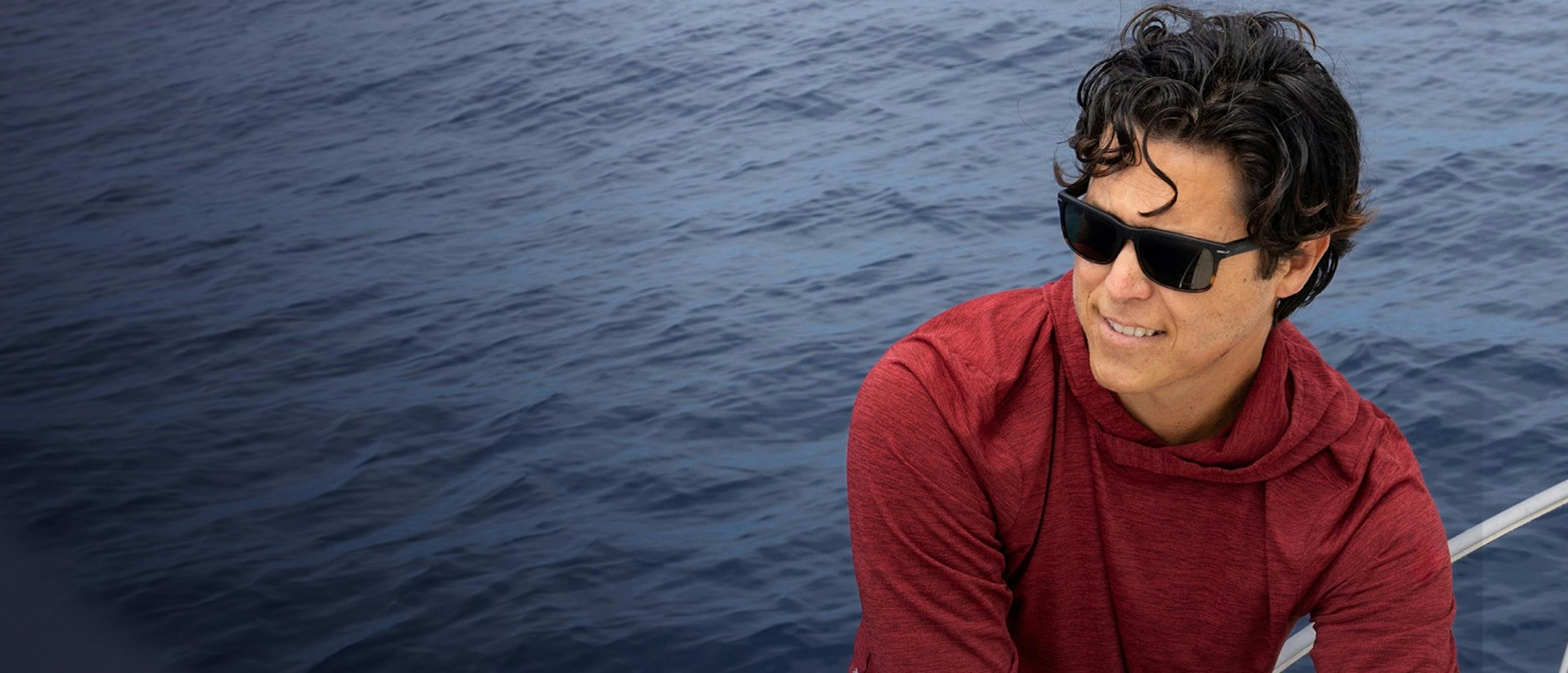 Man near ocean with Braker sunglasses