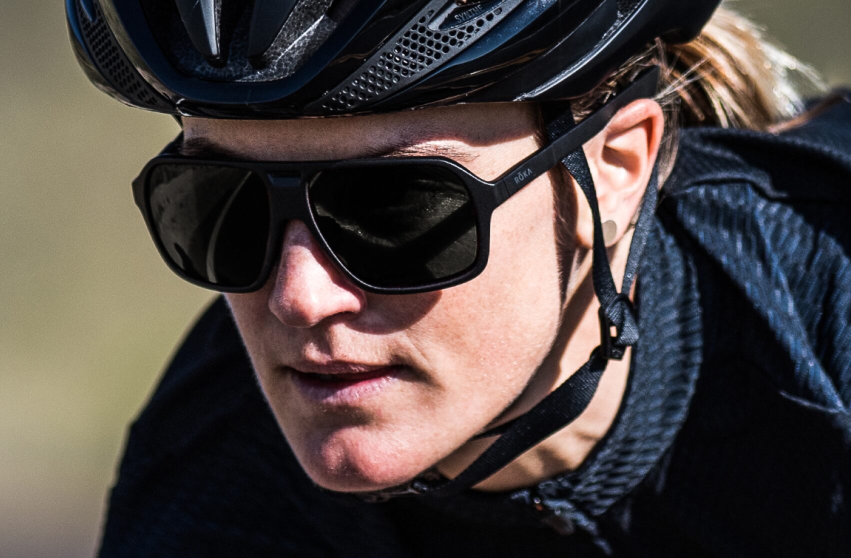 Woman in cycling helmet and Torino sunglasses