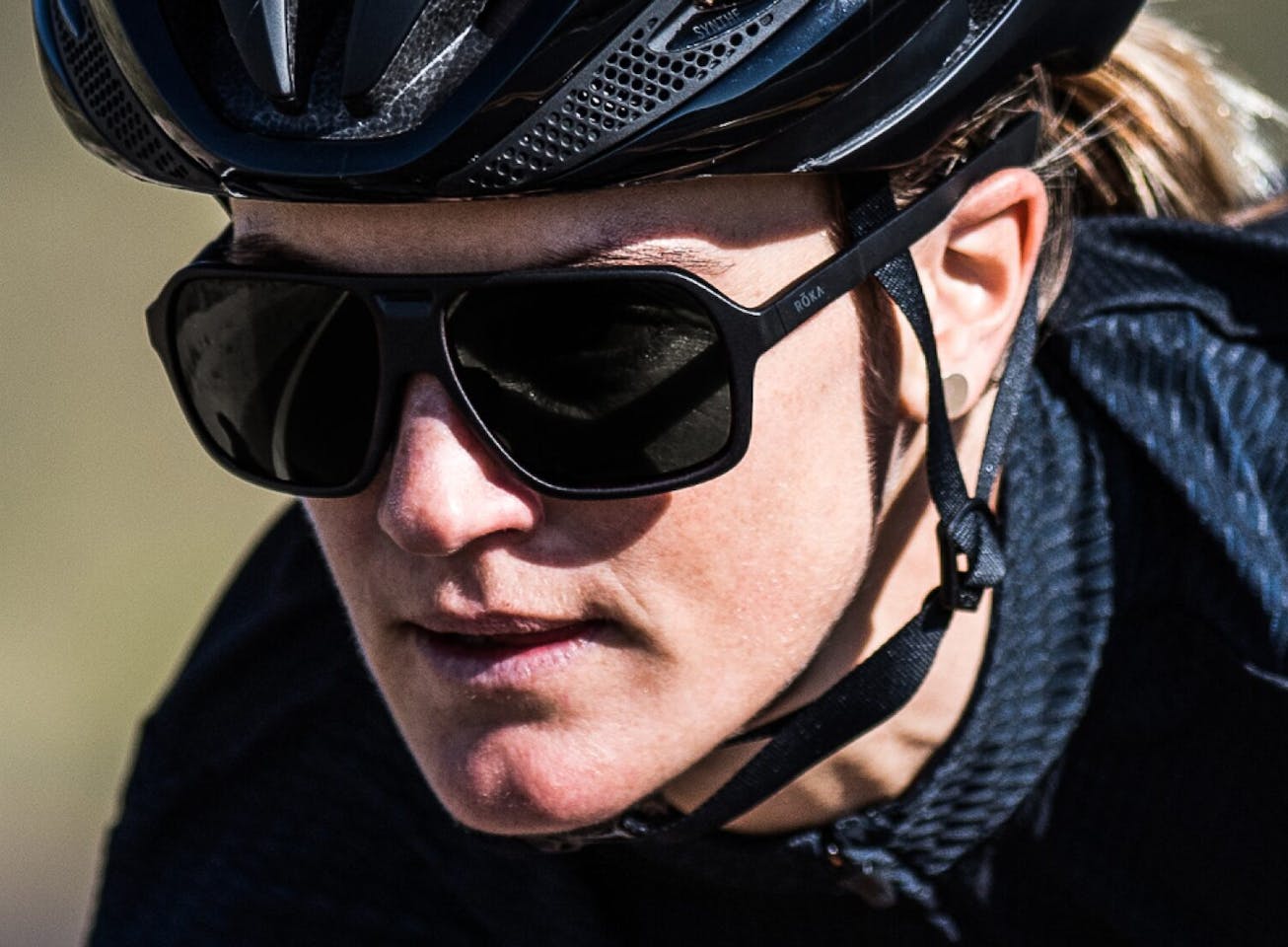 Woman in cycling helmet and Torino sunglasses