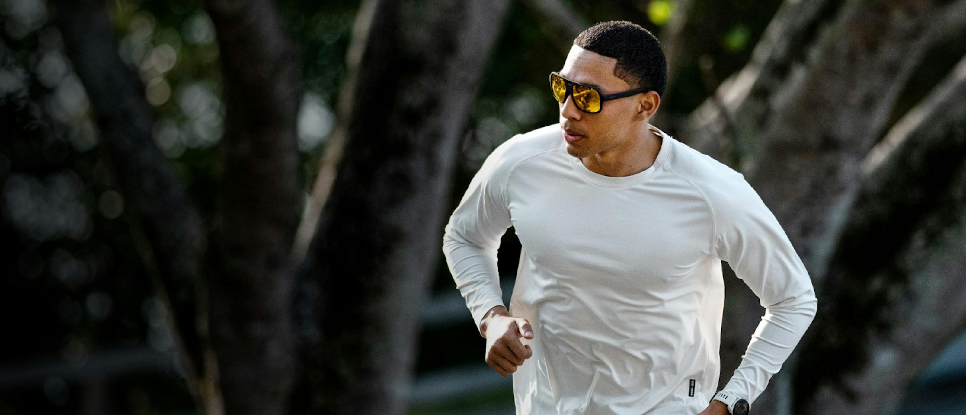 Man running in white long sleeve shirt