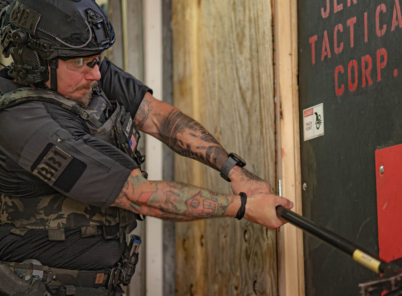 Man swinging hammer in ROKA Tactical glasses